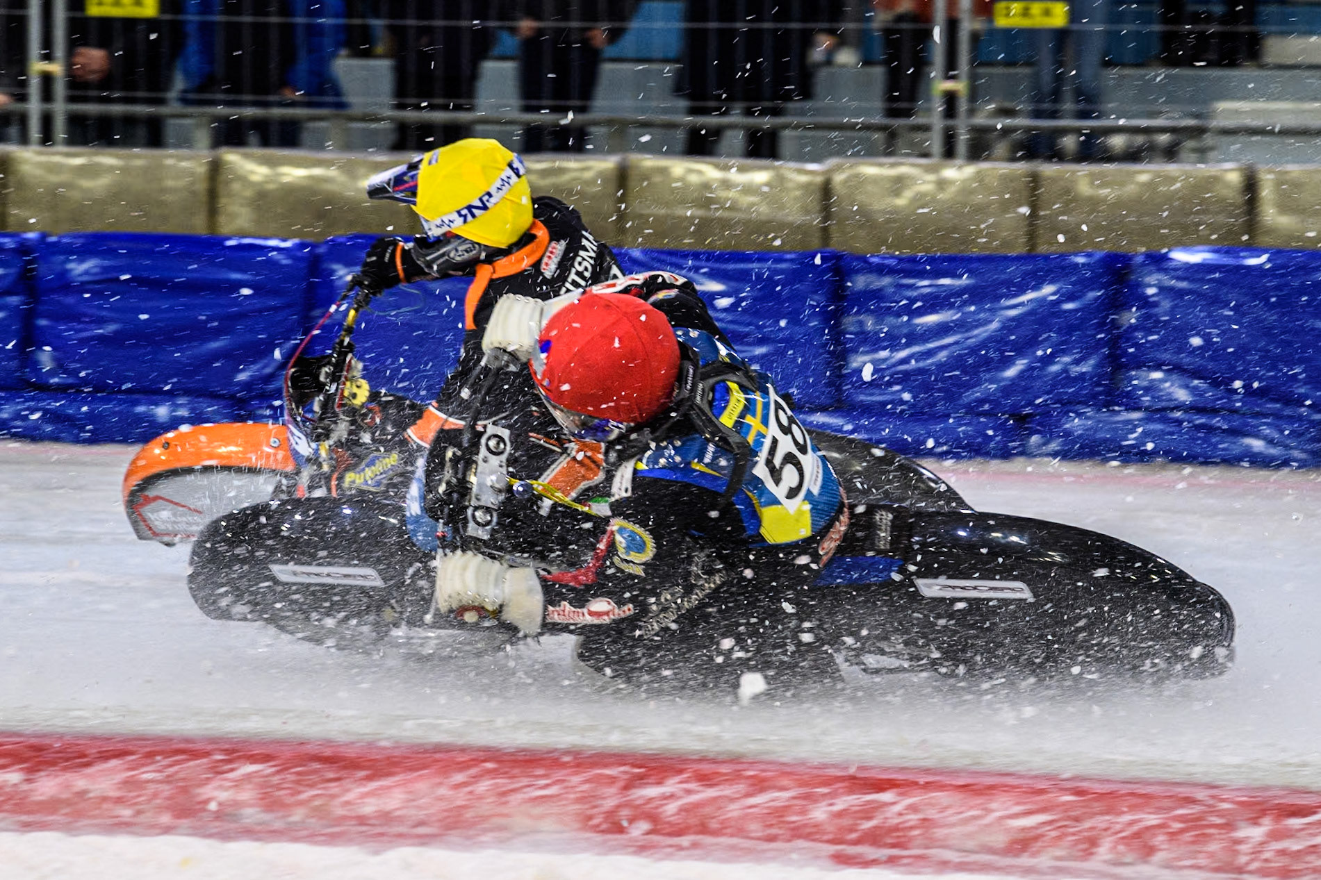 Sweden's Stefan Svensson (58) in Red rides inside Reserve Czech Republic's Lukáš Hutla (18) in Yellow during the FIM Ice Speedway Gladiators World Championship Final 3 at Ice Rink Thialf, Heerenveen on Saturday 6th April 2024. (Photo: Ian Charles | MI News)