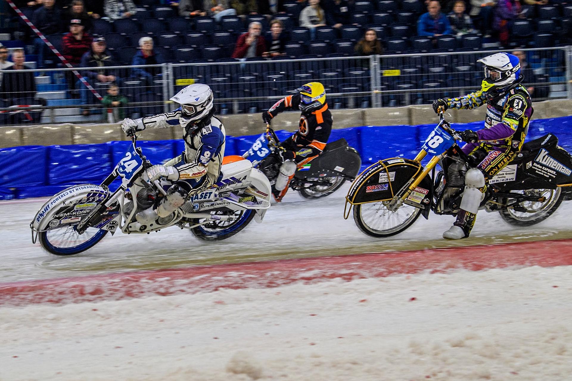 Finland's Max Koivula (24) in White leading Germany's Max Niedermaier (88) in Blue and Netherland's Sebastian Reitsma (283) in Yellow during the FIM Ice Speedway Gladiators World Championship Final 3 at Ice Rink Thialf, Heerenveen on Saturday 6th April 2024. (Photo: Ian Charles | MI News)