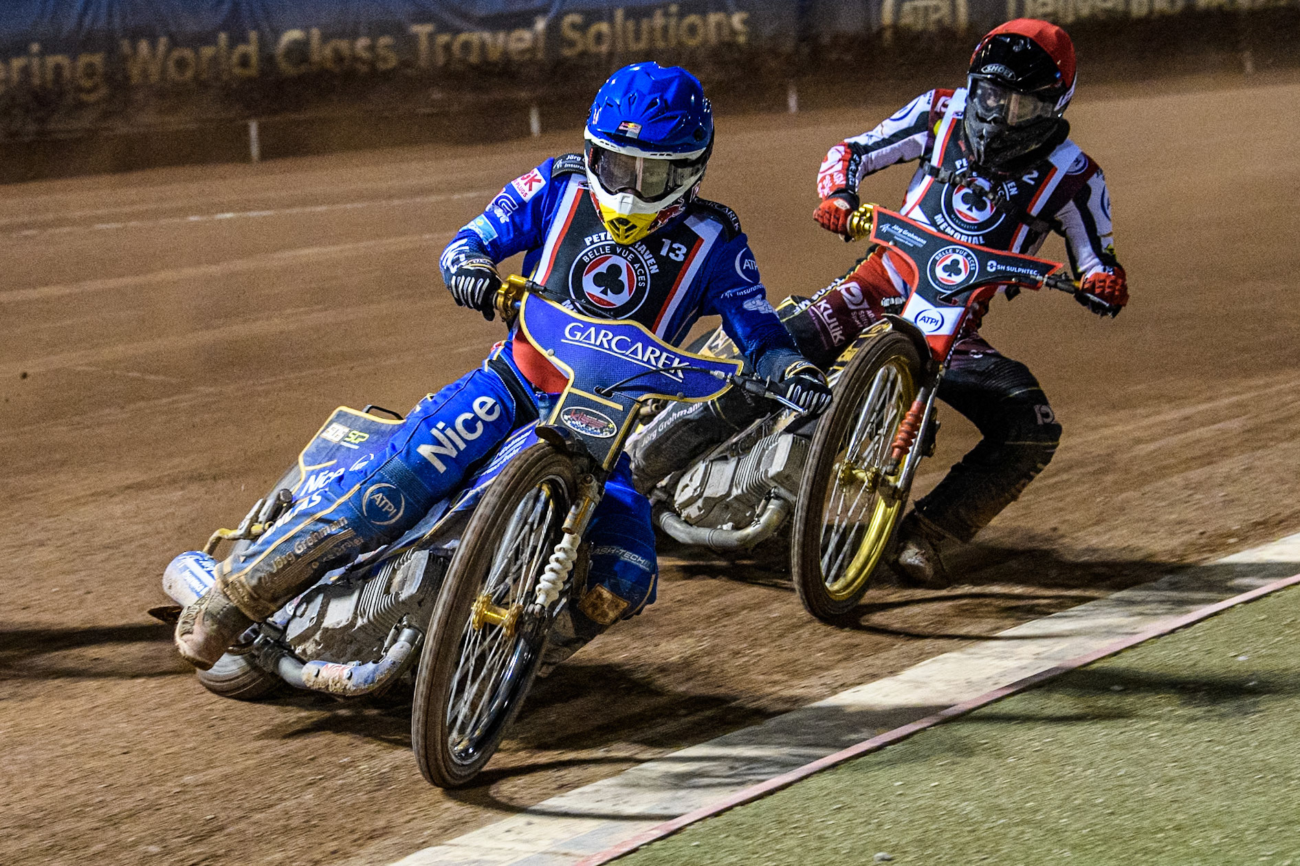 England's Robert Lambert (Blue) leads  Germany's Norick Blödorn (Red) during the Peter Craven Memorial Trophy meeting at the National Speedway Stadium, Manchester on Monday 18th March 2024. (Photo: Ian Charles | MI News)