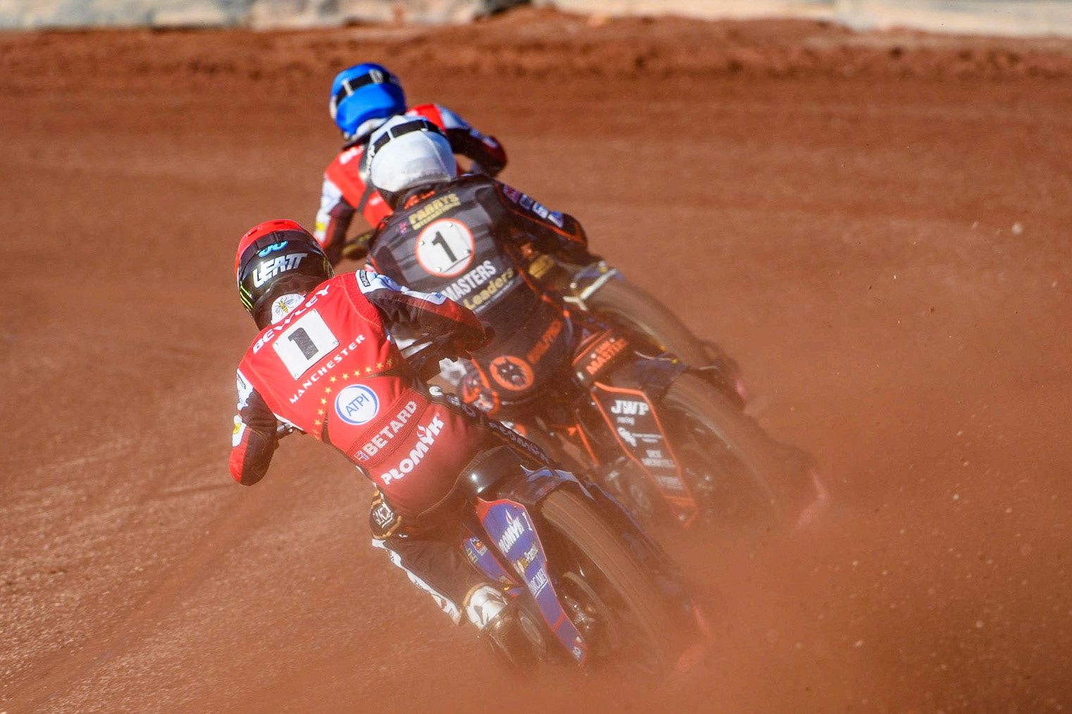Dan Bewley (Red) chases Sam Masters (White) and Norick Blodorn (Blue) during the Sports Insure Premiership match between Belle Vue Aces and Wolverhampton Wolves at the National Speedway Stadium, Manchester on Monday 3rd July 2023. (Photo: Ian Charles | MI News)