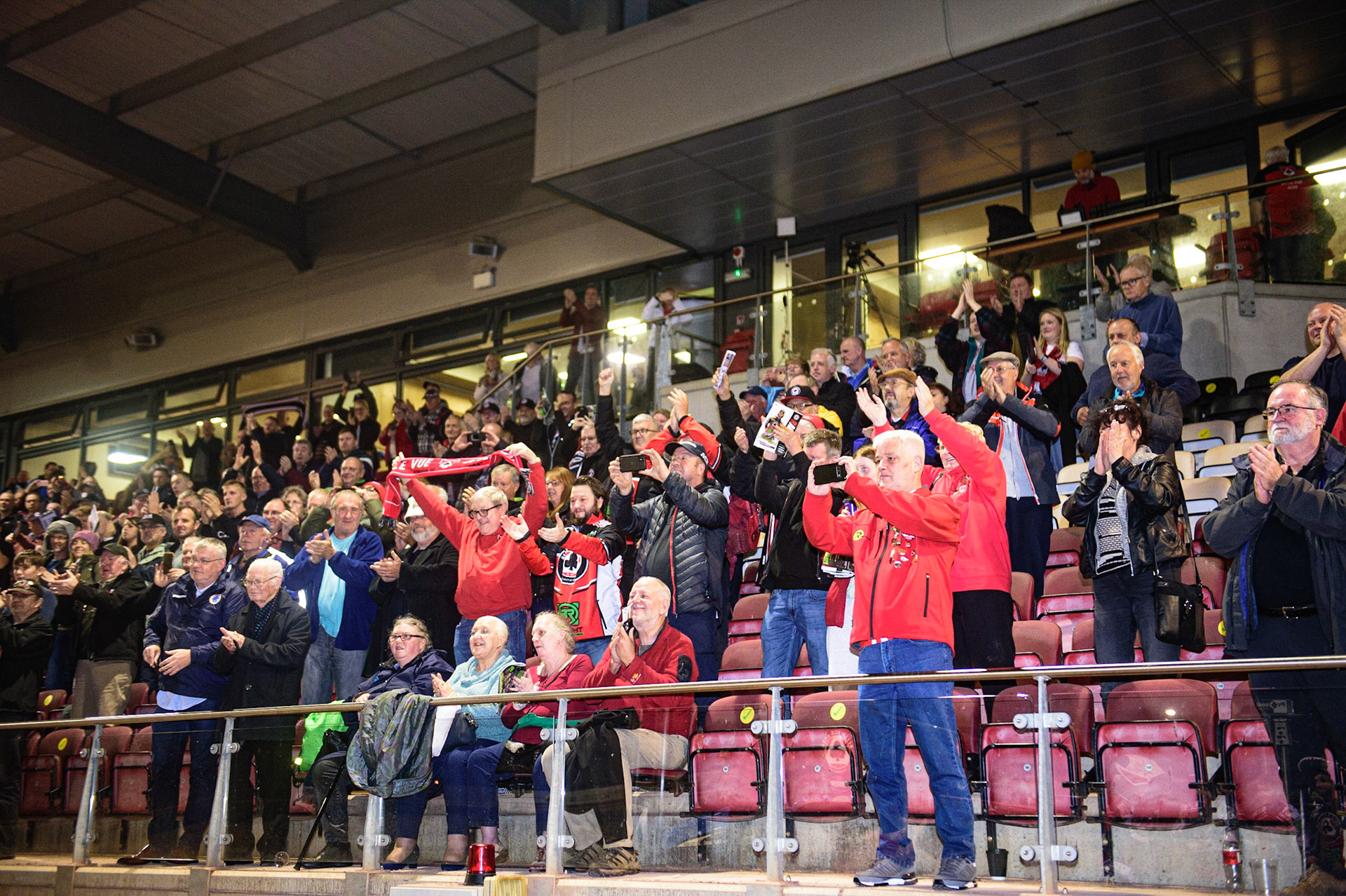MANCHESTER, UK. OCT 7TH  Belle Vue BikeRight Aces  fans celebrate during the SGB Premiership Play off Semi-Final Second Leg between Belle Vue Aces and Sheffield Tigers at the National Speedway Stadium, Manchester on Thursday 7th October 2021. (Credit: Ian Charles | MI News)
