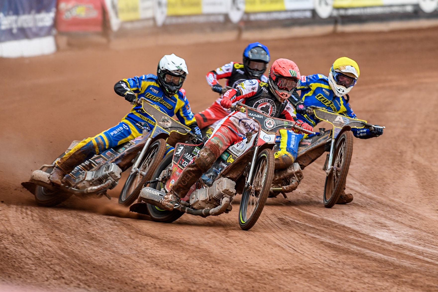 Jaimon Lidsey of Belle Vue Aces in Red leading Jack Holder of Sheffield Tigers in White Anders Rowe of Sheffield Tigers in Yellow and Zach Cook of Belle Vue Aces in Blue during the Rowe Motor Oil Premiership match between Belle Vue Aces and Sheffield Tigers at the National Speedway Stadium, Manchester on Monday 5th May 2025. (Photo: Ian Charles | MI News)