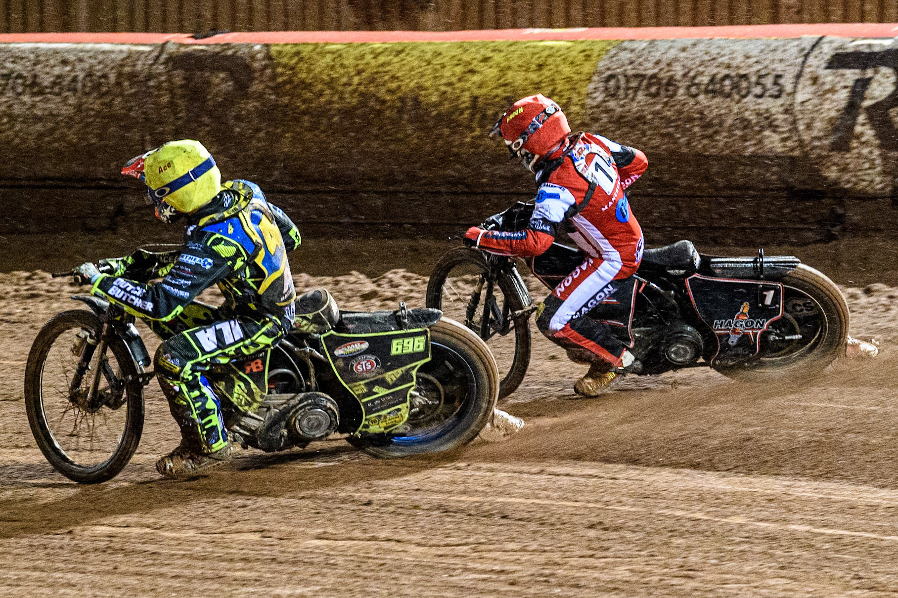 Sheffield Cubs' Ace Pijper \y\ rides inside Belle Vue Colts' Sam Hagon in Red during the WSRA National Development League match between Belle Vue Colts and Sheffield Tiger Cubs at the National Speedway Stadium, Manchester on Monday 7th October 2024. (Photo: Ian Charles | MI News)