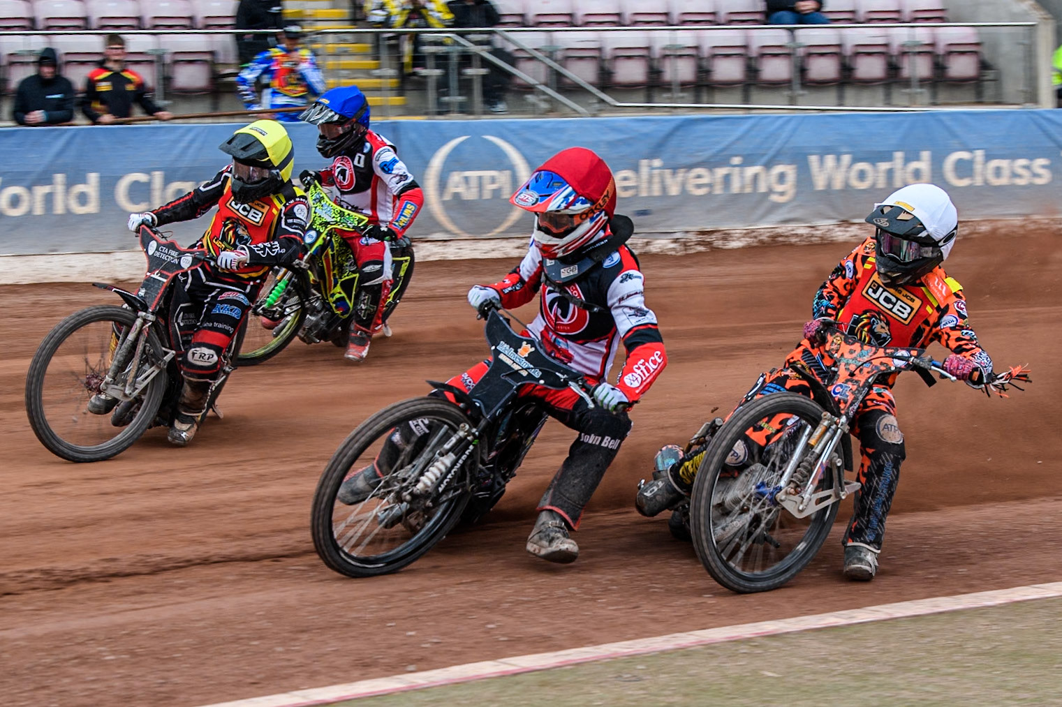 Leicester Lion Cubs' Cooper Rushen in White rides inside Belle Vue Colts' Freddy Hodder in Red, Leicester Lion Cubs' Guest Rider Ben Morley in Yellow and Belle Vue Colts' William Cairns in Blue during the WSRA National Development League match between Belle Vue Colts and Leicester Lion Cubs at the National Speedway Stadium, Manchester on Friday 18th April 2025. (Photo: Ian Charles | MI News)