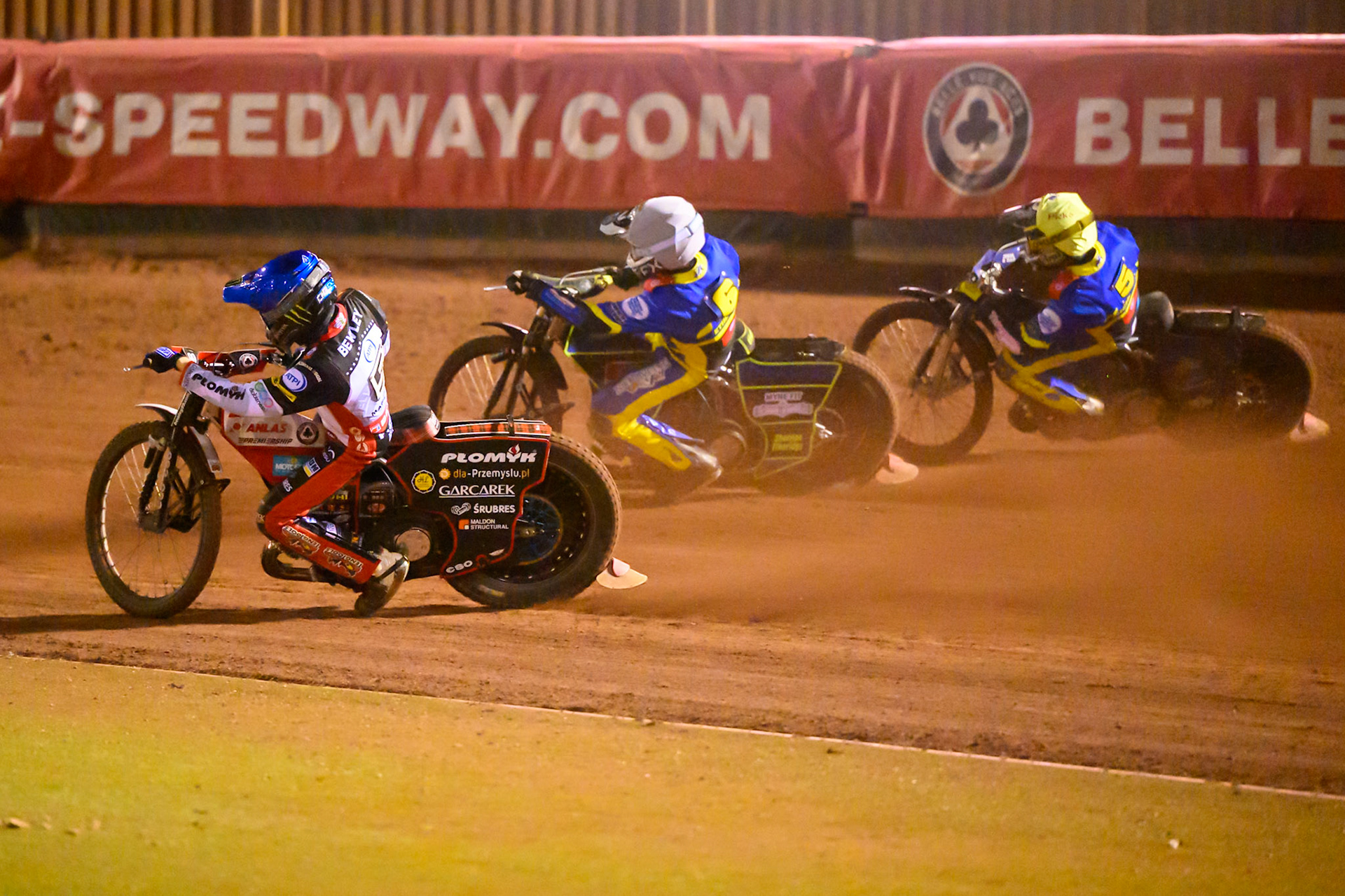 Dan Bewley of Belle Vue Aces   in Blue rides inside Jye Etheridge of Sheffield Tigers  in White and Josh Pickering of Sheffield Tigers in Yellow  during the Knockout Cup, Northern Section match between Belle Vue Aces and Sheffield Tigers at the National Speedway Stadium, Manchester on Monday 30th March 2026. (Photo: Ian Charles | MI News)