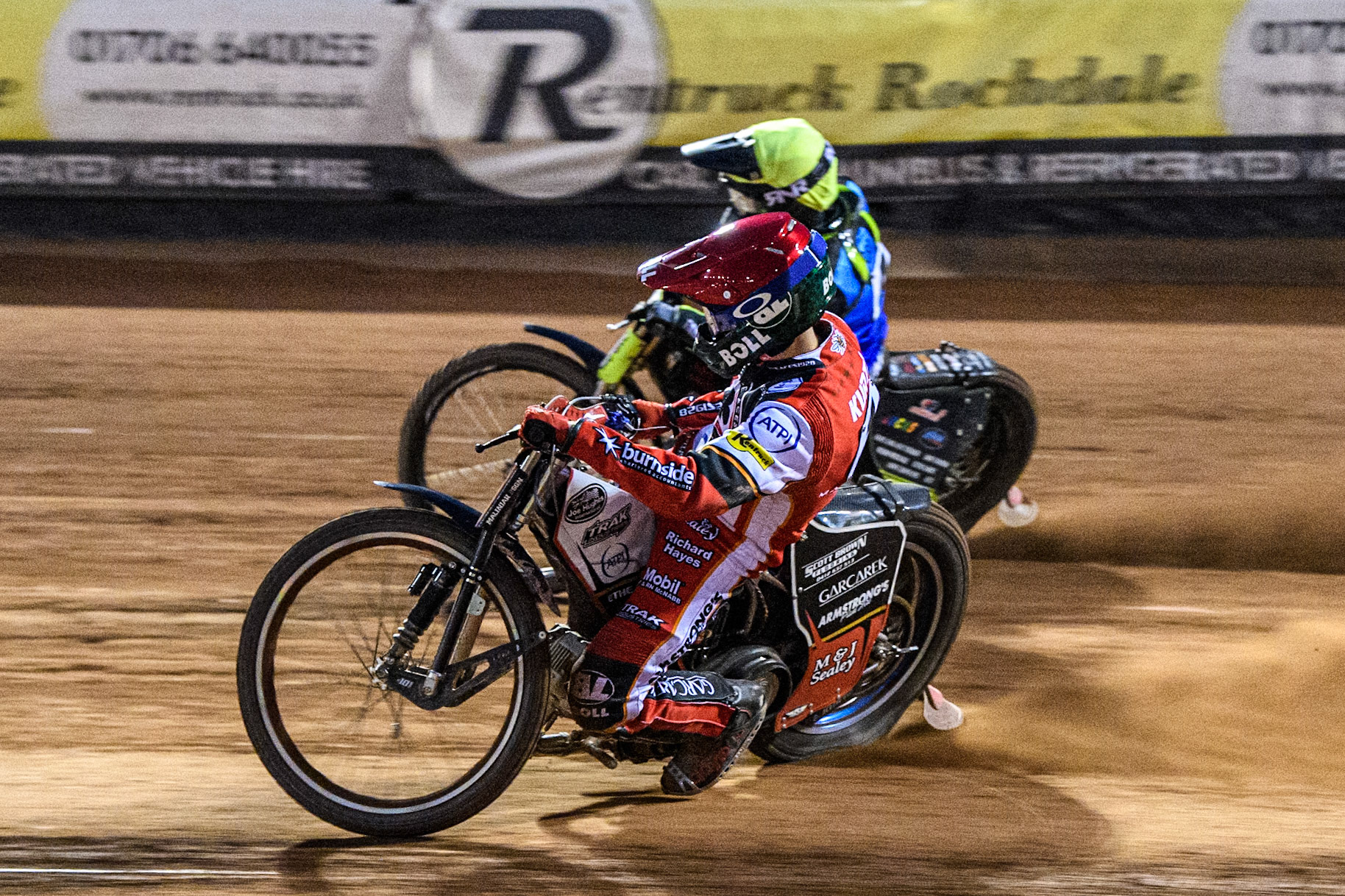Belle Vue Aces' Brady Kurtz in Red rides inside Oxford Spires' Guest Rider Dan Thompson in Yellow during the Rowe Motor Oil Premiership match between Belle Vue Aces and Oxford Spires at the National Speedway Stadium, Manchester on Monday 14th April 2025. (Photo: Ian Charles | MI News)