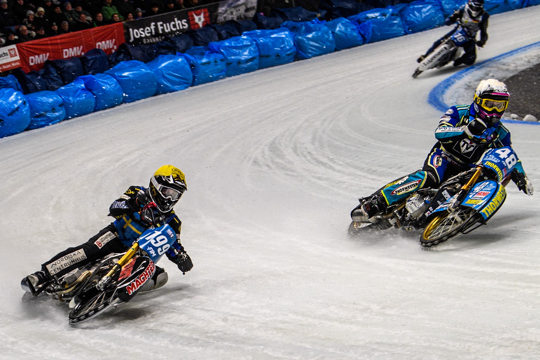 Martin Haarahiltunen (199) of Sweden in Yellow rides outside Luca Bauer (48) of Germany in White during the Ice Speedway Gladiators World Championship Final 1 at Max-Aicher-Arena, Inzell on Saturday 15th March 2025. (Photo: Ian Charles | MI News)