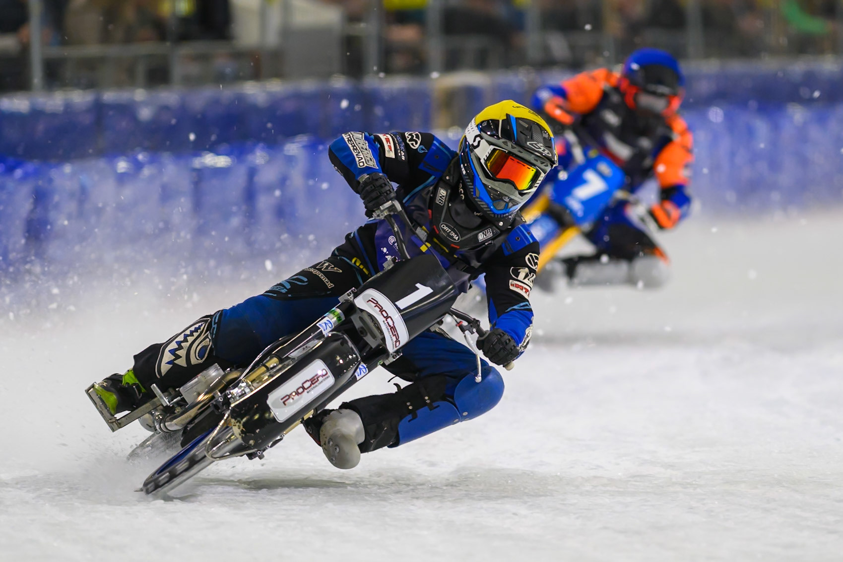 Niclas Svensson (1) of Sweden  in Yellow leading Lukáš Hutla (7) of Czechia  in Blue during the FIM Ice Speedway Of Nations at Ice Rink Thialf, Heerenveen on Sunday 12th April 2026. (Photo: Ian Charles | MI News)