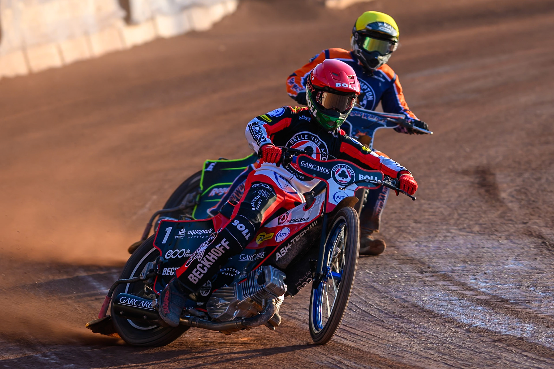 Brady Kurtz of Belle Vue Aces in Red leading Troy Batchelor of Northampton Foxes  in Yellow during the Rowe Motor Oil Premiership match between Belle Vue Aces and Northampton Foxes at the National Speedway Stadium, Manchester on Monday 13th July 2026. (Photo: Ian Charles | MI News)