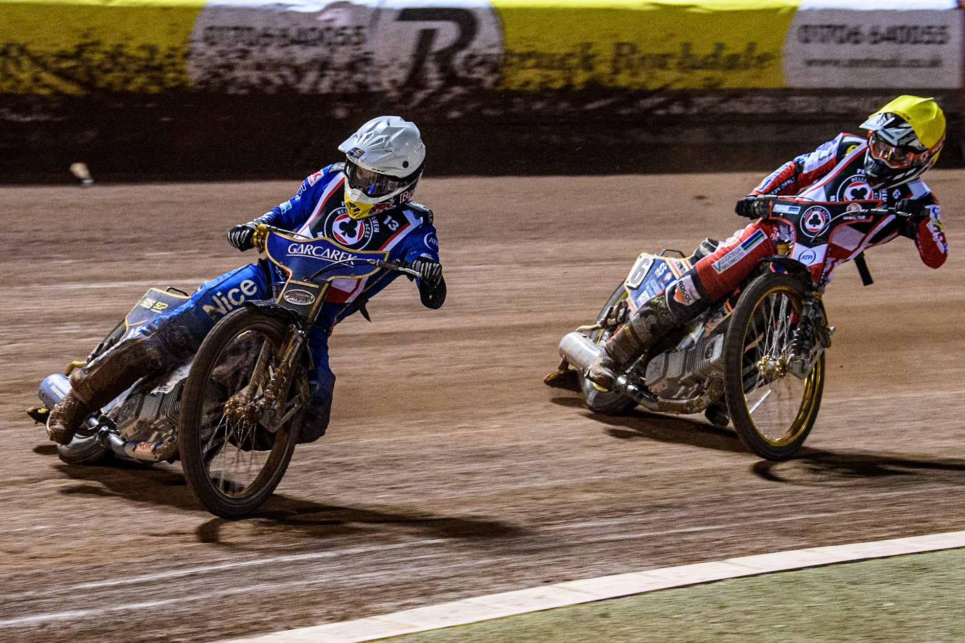 England's Robert Lambert (White) leads  England's Connor Mountain (Yellow) during the Peter Craven Memorial Trophy meeting at the National Speedway Stadium, Manchester on Monday 18th March 2024. (Photo: Ian Charles | MI News)