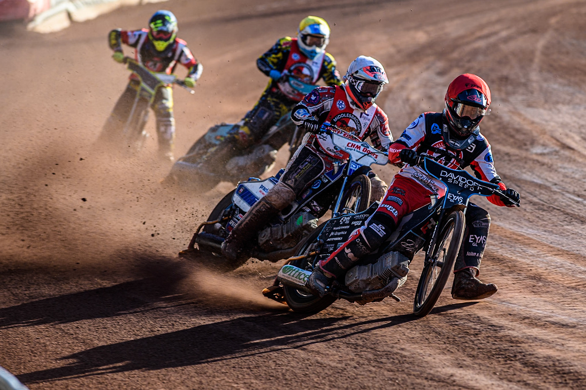 Belle Vue Colts' Freddy Hodder in Red leading Middlesbrough Tigers' Danny Phillips in White Middlesbrough Tigers' Jamie Halder in Yellow and Belle Vue Colts' Guest rider Keiran Douglas in Blue during the WSRA National Development League match between Belle Vue Colts and Middlesbrough Tigers at the National Speedway Stadium, Manchester on Monday 17th June 2024. (Photo: Ian Charles | MI News)