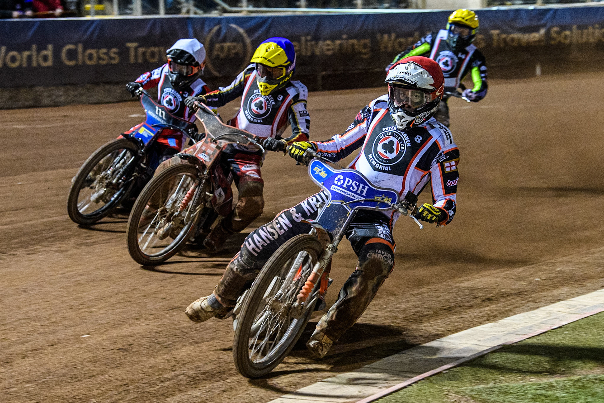 Denmark's Niels-Kristian Iversen (Red) leads  Poland's Patryk Wojdylo (Blue) Australia's Ben Cook (White) and Australia's Jason Doyle (Yellow) during the Peter Craven Memorial Trophy meeting at the National Speedway Stadium, Manchester on Monday 18th March 2024. (Photo: Ian Charles | MI News)
