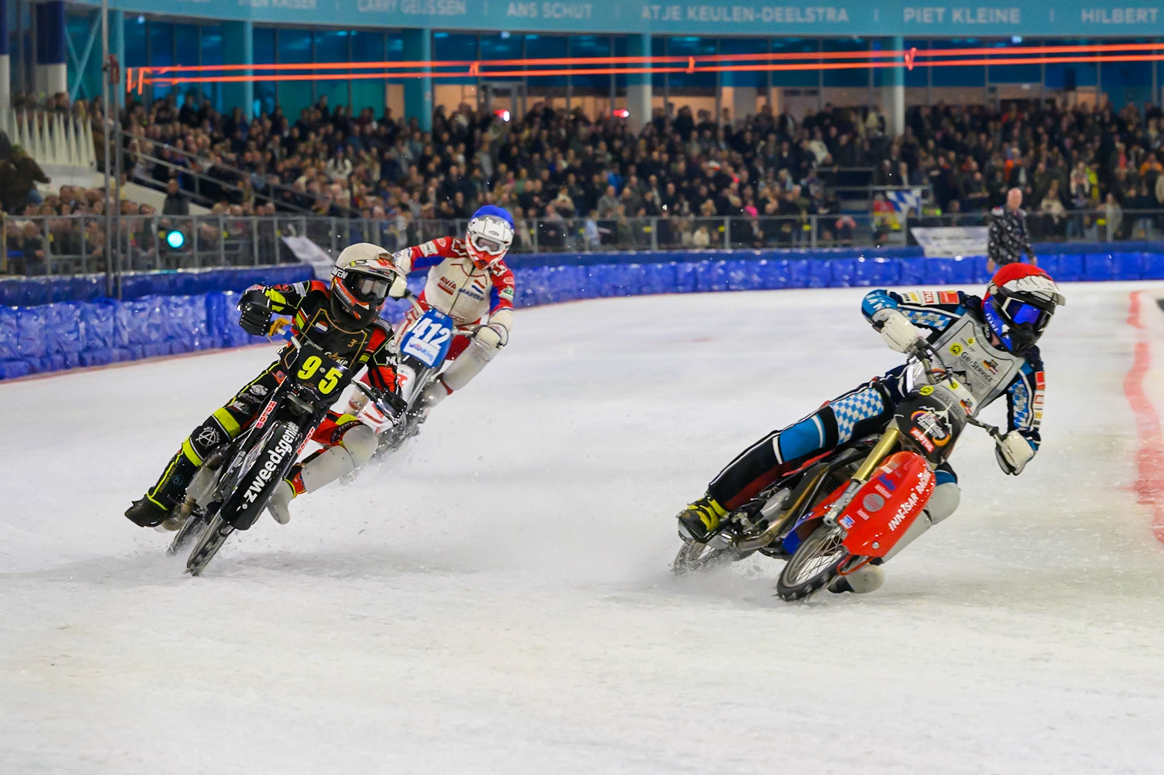 Simon Mayer of Germany in Red rides inside Niek Meijerink of The Netherlands  in White with Niek Schaap of The Netherlands  in Blue behind during the ROELOF THIJS BOKAAL at Ice Rink Thialf, Heerenveen on Friday 10th April 2026.  (Photo: Ian Charles | MI News)