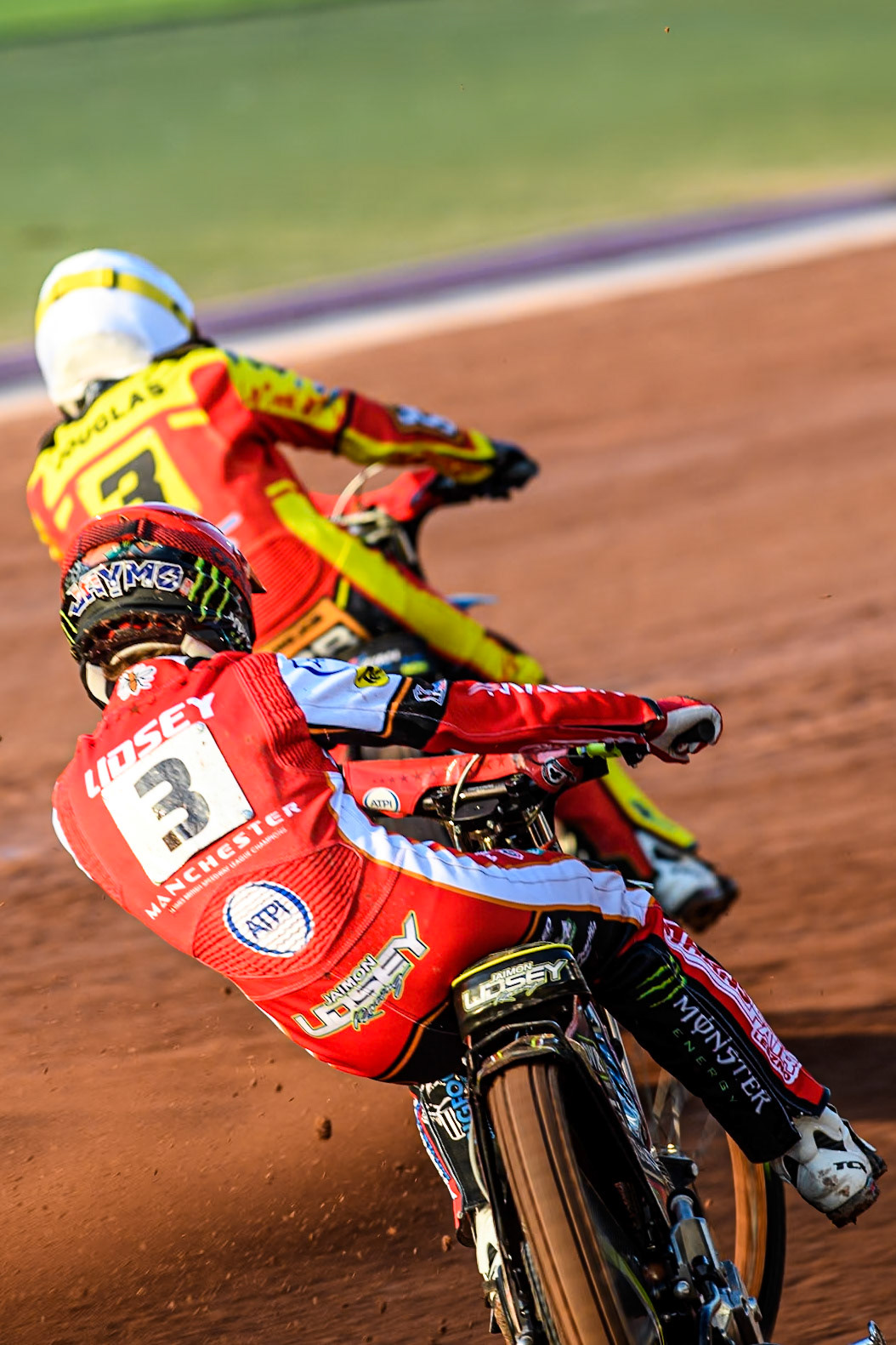 Belle Vue Aces' Jaimon Lidsey in Red chases Leicester Lions' Ryan Douglas in White during the Rowe Motor Oil Premiership match between Belle Vue Aces and Leicester Lions at the National Speedway Stadium, Manchester on Monday 19th May 2025. (Photo: Ian Charles | MI News)