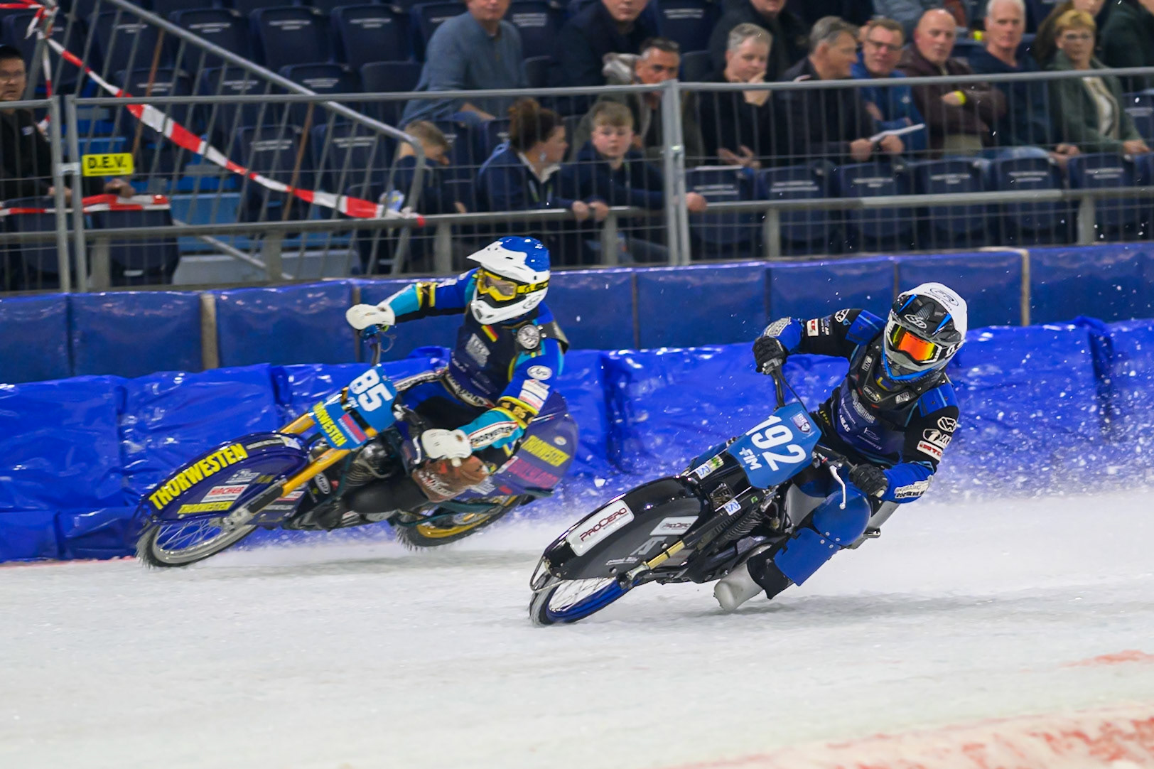Niclas Svensson (192) of Sweden  in White rides inside Luca Bauer (85) of Italy/Germany  in Blue during the FIM Ice Speedway Gladiators World Championship Final 3 at Ice Rink Thialf, Heerenveen on Saturday 11th April 2026. (Photo: Ian Charles | MI News)