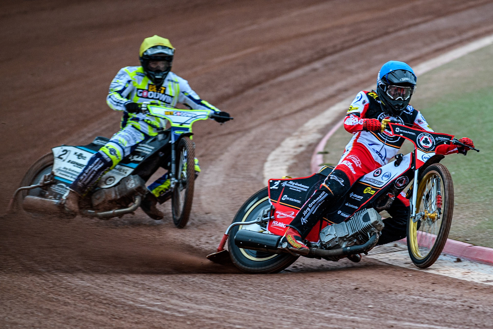 Belle Vue Aces' Norick Blodorn in Blue leading Oxford Spires' Erik Riss in Yellow during the Rowe Motor Oil Premiership match between Belle Vue Aces and Oxford Spires at the National Speedway Stadium, Manchester on Monday 14th April 2025. (Photo: Ian Charles | MI News)