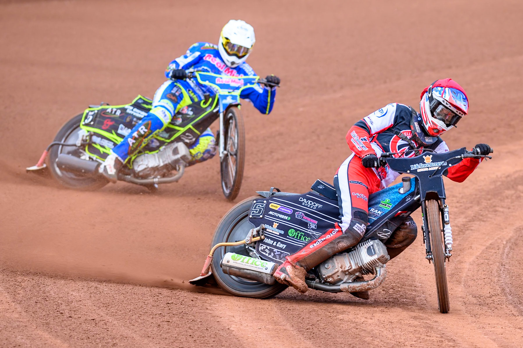 Belle Vue Colts' Freddy Hodder in Red leading Oxford Chargers' Darryl Ritchings  in White during the WSRA National Development League match between Belle Vue Colts and Oxford Chargers at the National Speedway Stadium, Manchester on Sunday 1st June 2025. (Photo: Ian Charles | MI News)