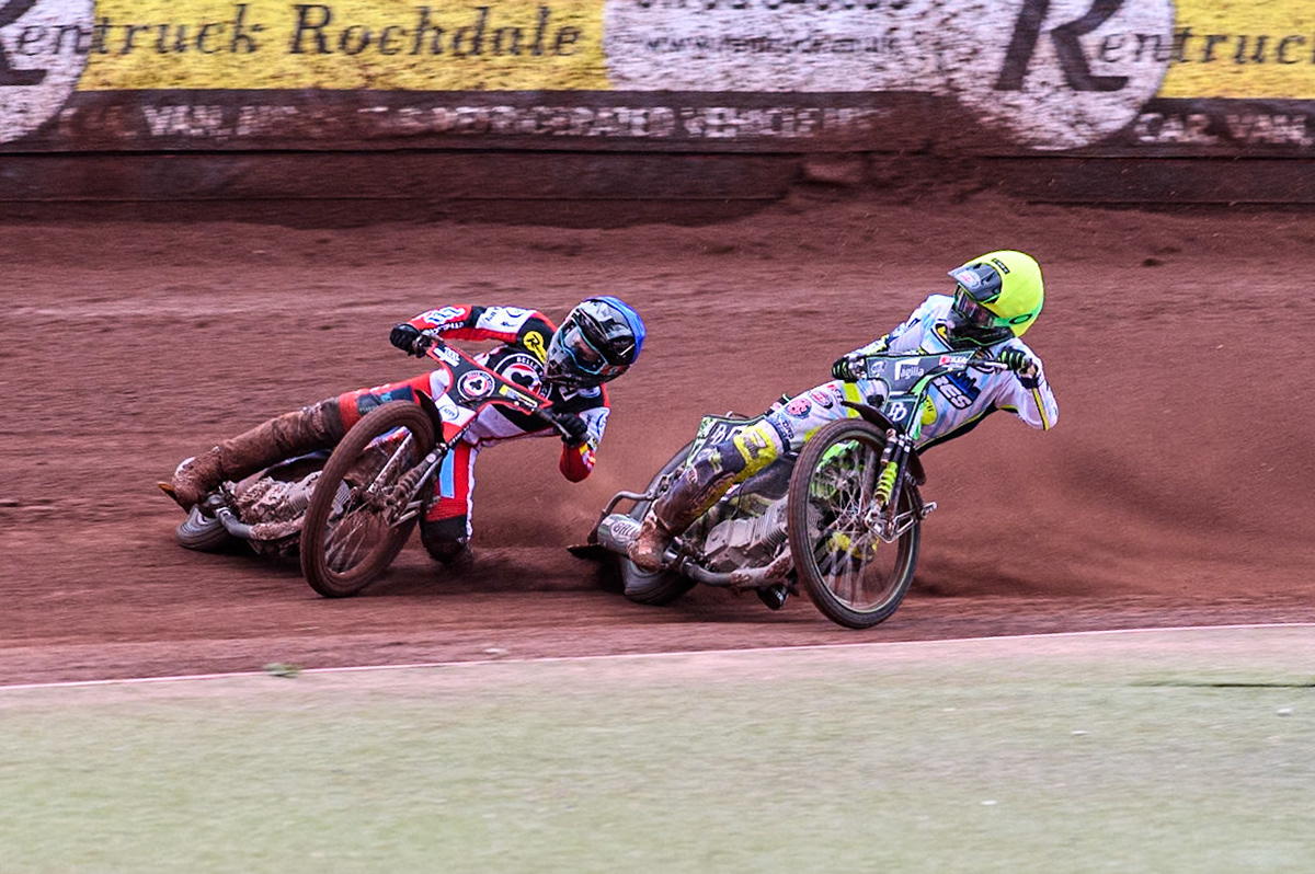 Belle Vue Aces' Ben Cook in Blue loses control after a tangle with Oxford Spires' Charles Wright in Yellow during the Rowe Motor Oil Premiership match between Belle Vue Aces and Oxford Spires at the National Speedway Stadium, Manchester on Monday 22nd July 2024. (Photo: Ian Charles | MI News)