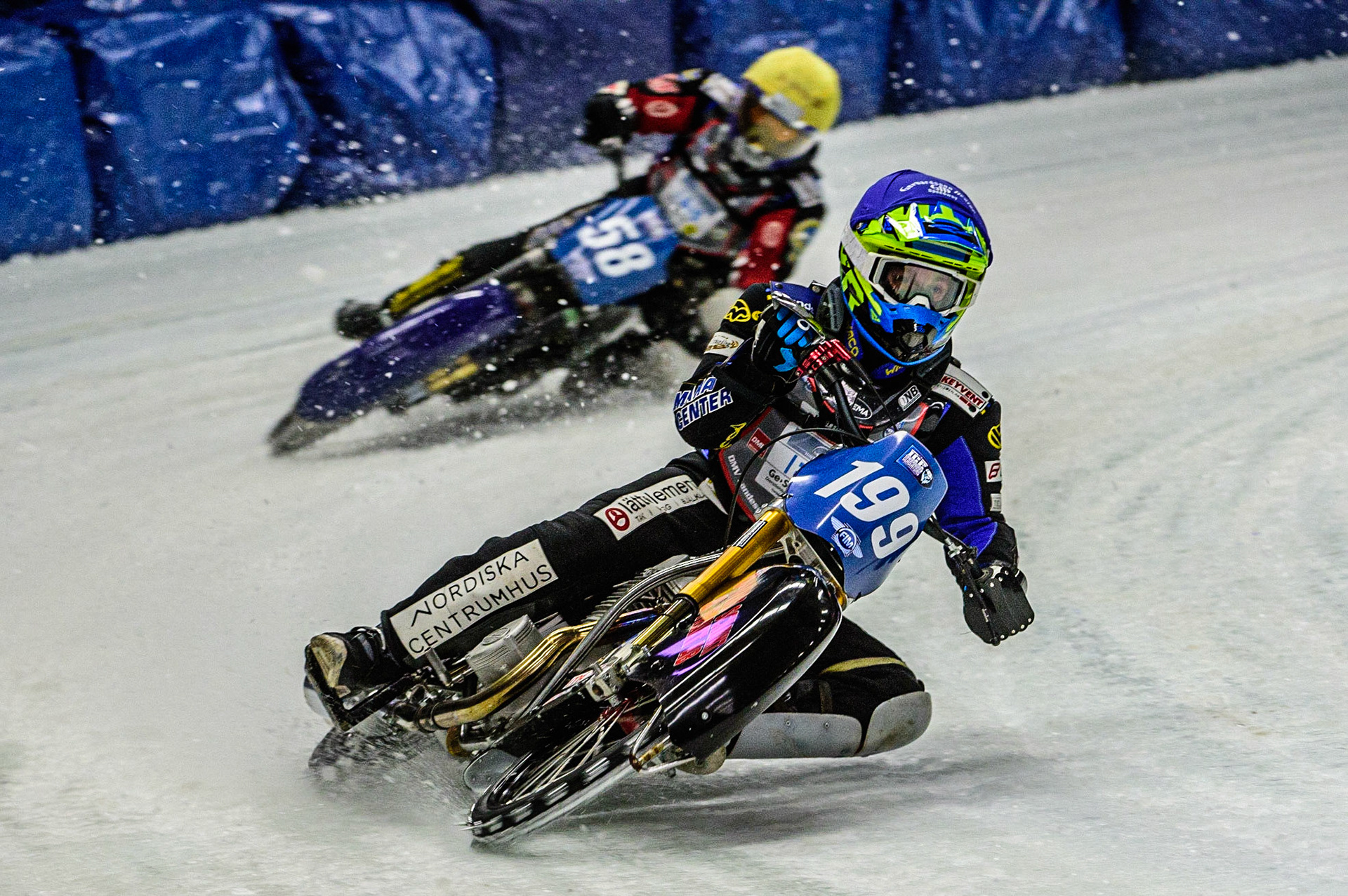 Martin Haarahiltunen (199) (Blue) leads Stefan Svensson (58) (Yellow)  during the Ice Speedway Gladiators World Championship Final 1 at Max-Aicher-Arena, Inzell, Germany on Saturday 18th March 2023. (Photo: Ian Charles | MI News)