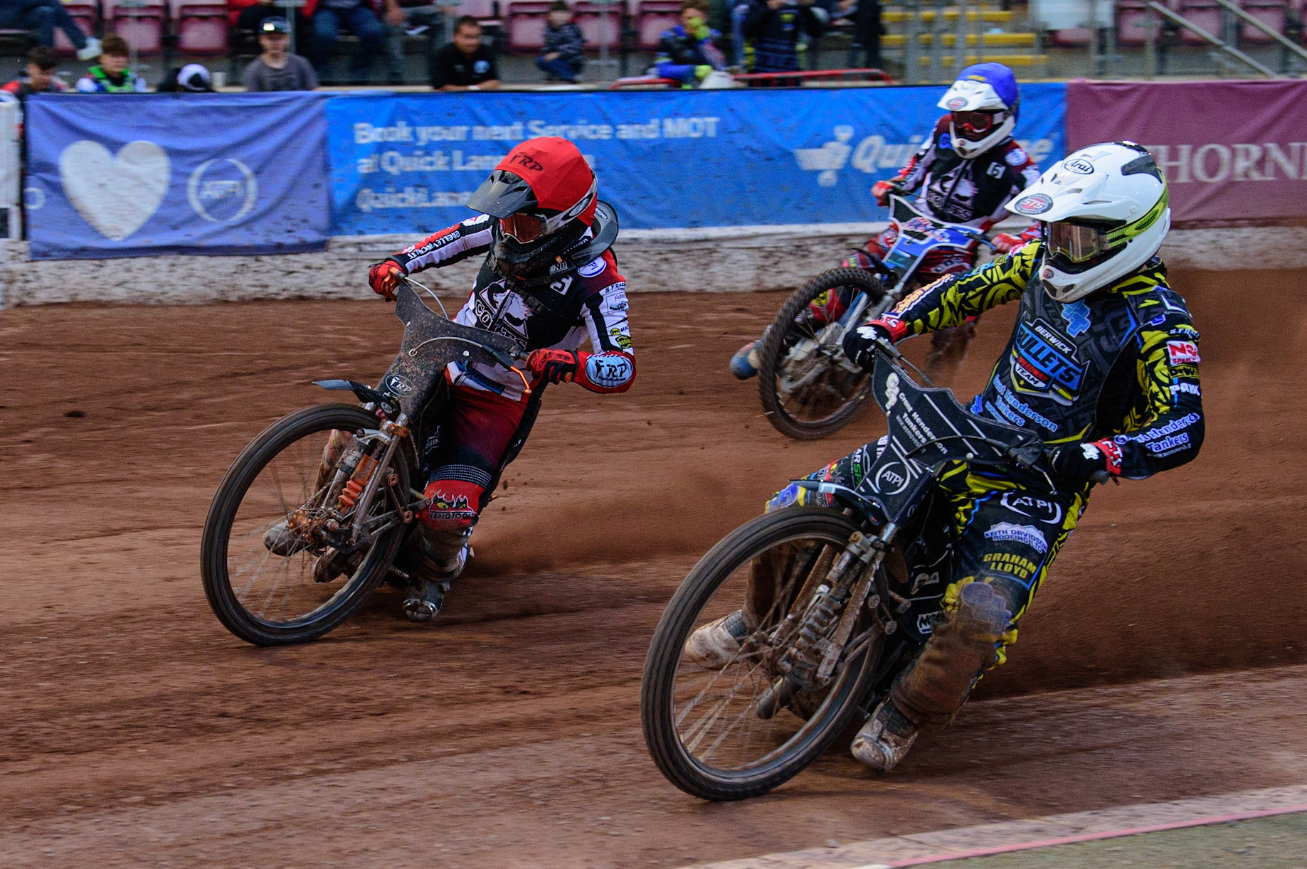 MANCHESTER, UK. JUN 24TH  Kyle Bickley  (White) inside Jack Smith  (Red) with Archie Freeman (Blue) behind during the National Development League match between Belle Vue Colts and Berwick Bullets at the National Speedway Stadium, Manchester on Friday 24th June 2022. (Credit: Ian Charles | MI News)