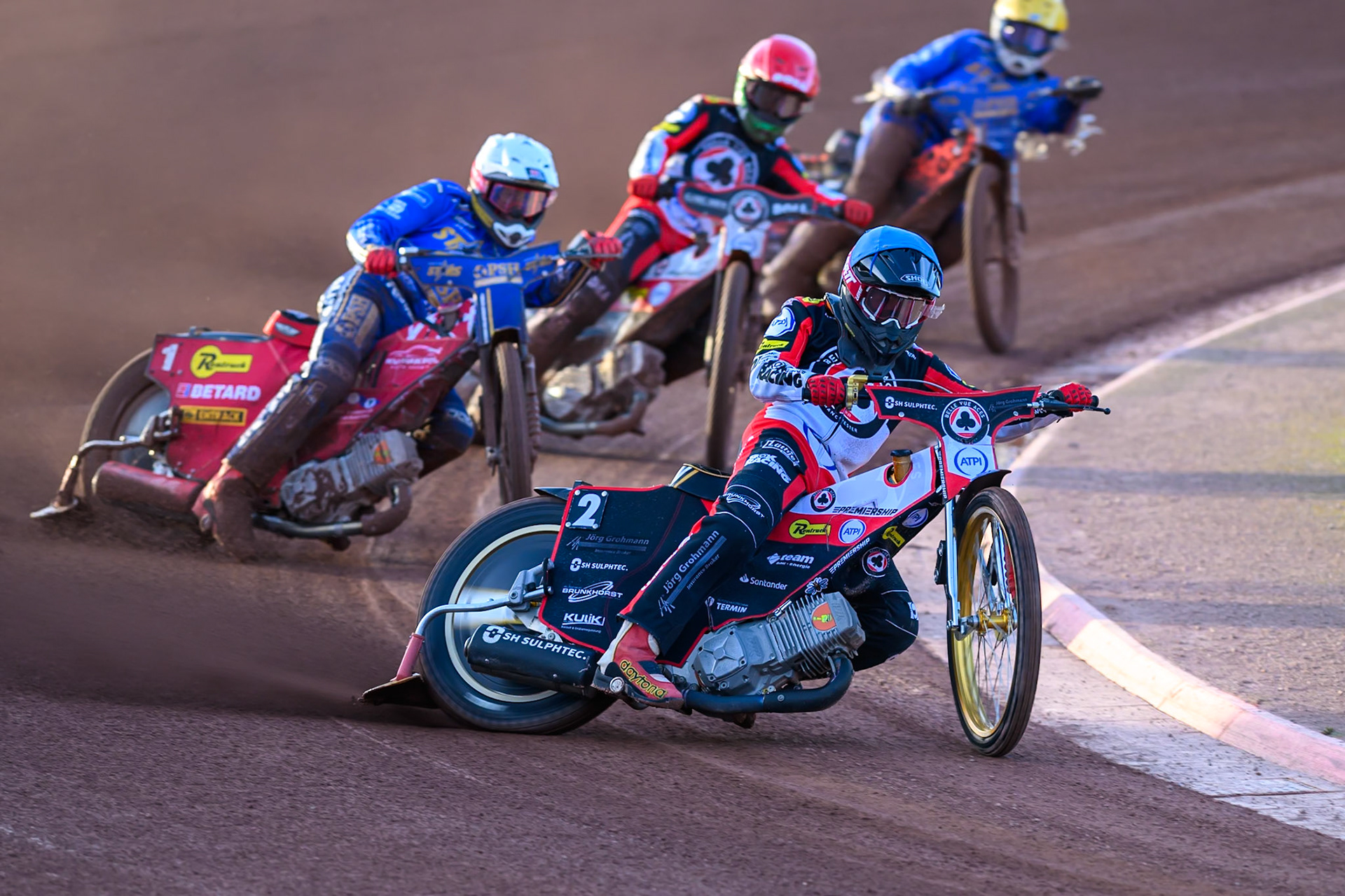 Norick Blödorn of Belle Vue Aces in Blue leading Max Fricke of Kings Lynn Stars in White ,Brady Kurtz of Belle Vue Aces in Red and Cooper Rushen of Kings Lynn Stars in Yellow during the Rowe Motor Oil Premiership match between Belle Vue Aces and King's Lynn Stars at the National Speedway Stadium, Manchester on Monday 10th August 2026. (Photo: Ian Charles | MI News)