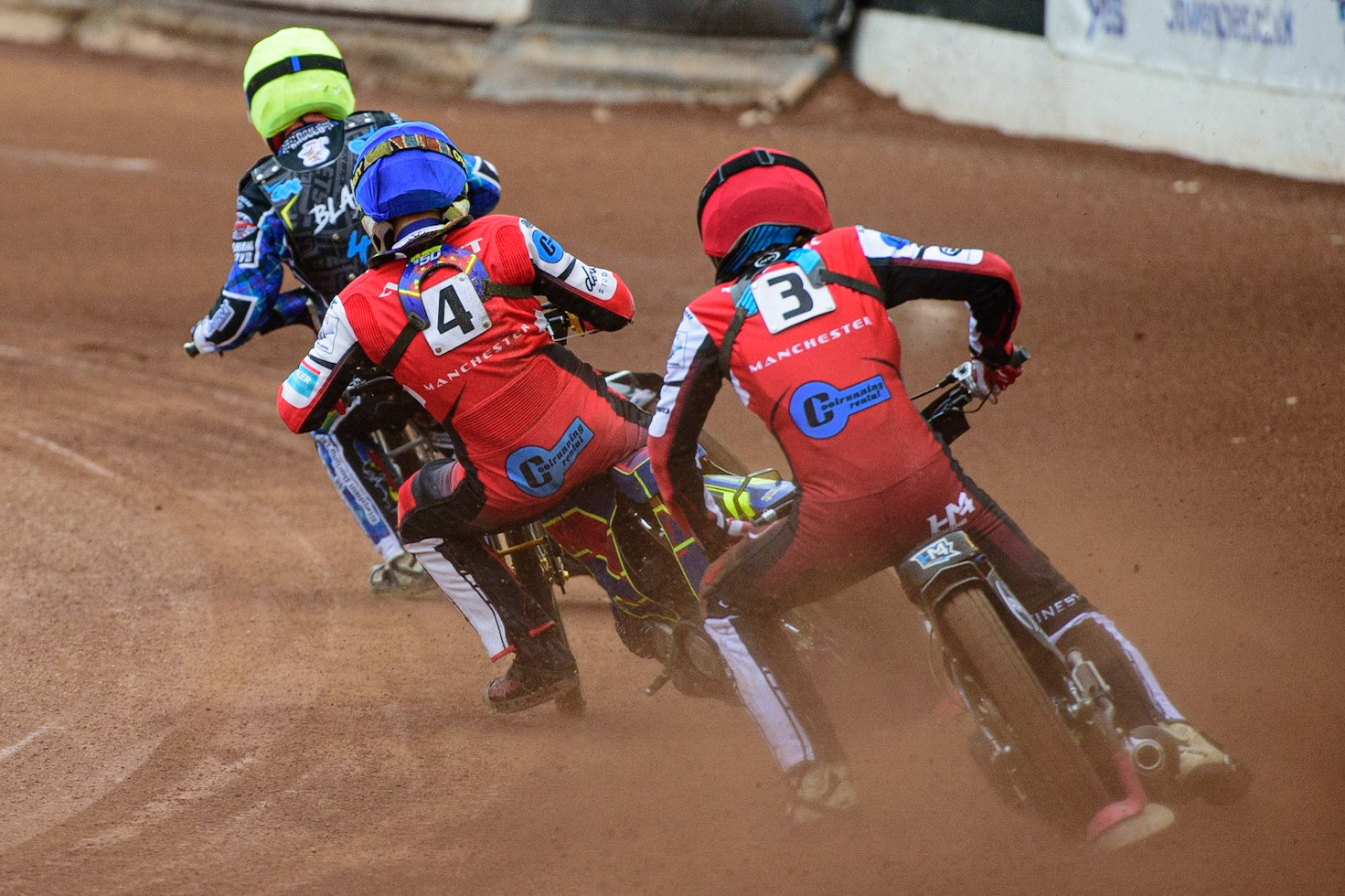 MANCHESTER, UK. JUN 24TH  Harry McGurk  (Red) and Nathan Ablitt  (Blue) chase Greg Blair (Yellow) during the National Development League match between Belle Vue Colts and Berwick Bullets at the National Speedway Stadium, Manchester on Friday 24th June 2022. (Credit: Ian Charles | MI News)