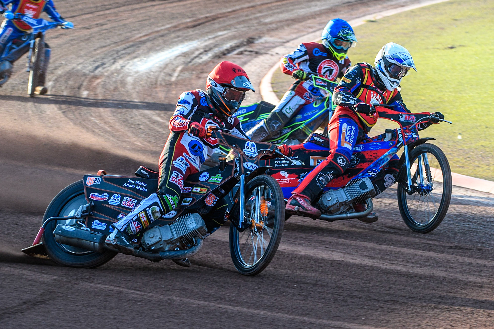 Jack Smith (Red) outside Jacob Hook (White) with Luke Muff (Blue) behind during the National Development League match between Belle Vue Colts and Kent Royals at the National Speedway Stadium, Manchester on Friday 7th July 2023. (Photo: Ian Charles | MI News)