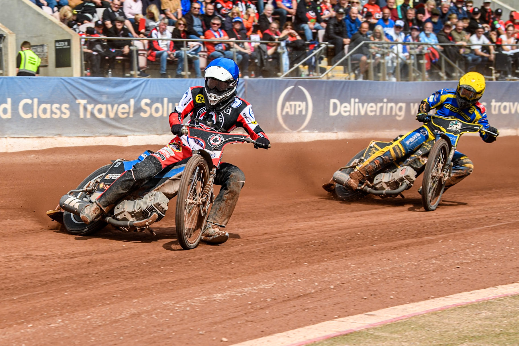 Belle Vue Aces' Antti Vuolas in Blue leading Sheffield Tigers' Kyle Howarth  in Yellow during the Rowe Motor Oil Premiership match between Belle Vue Aces and Sheffield Tigers at the National Speedway Stadium, Manchester on Monday 26th August 2024. (Photo: Ian Charles | MI News)
