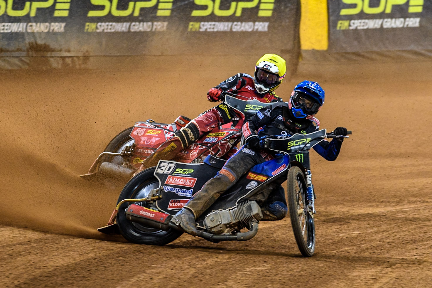 Leon Madsen (30) of Denmark in Blue leading Max Fricke (46) of Australia in Yellow during the FIM Speedway Grand Prix of Great Britain at The Principality Stadium, Cardiff on Saturday 17th August 2024. (Photo: Ian Charles | MI News)