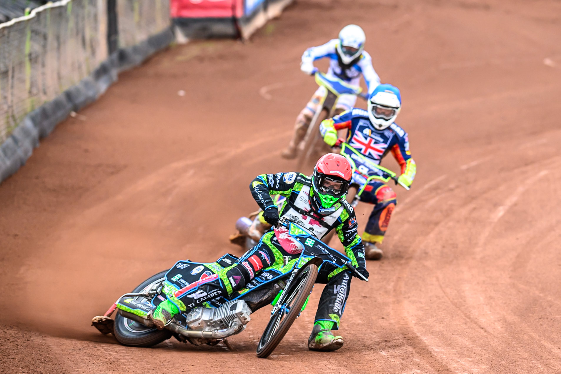 Mikkel Andersen of Denmark in Red leading Jake Mulford of Great Britain in Blue and Otto Raak of Finland in White during the FIM SGP2 Qualifying Round at the Peugeot Ashfield Stadium in Glasgow on Saturday 24th May 2025. (Photo: Ian Charles | MI News)