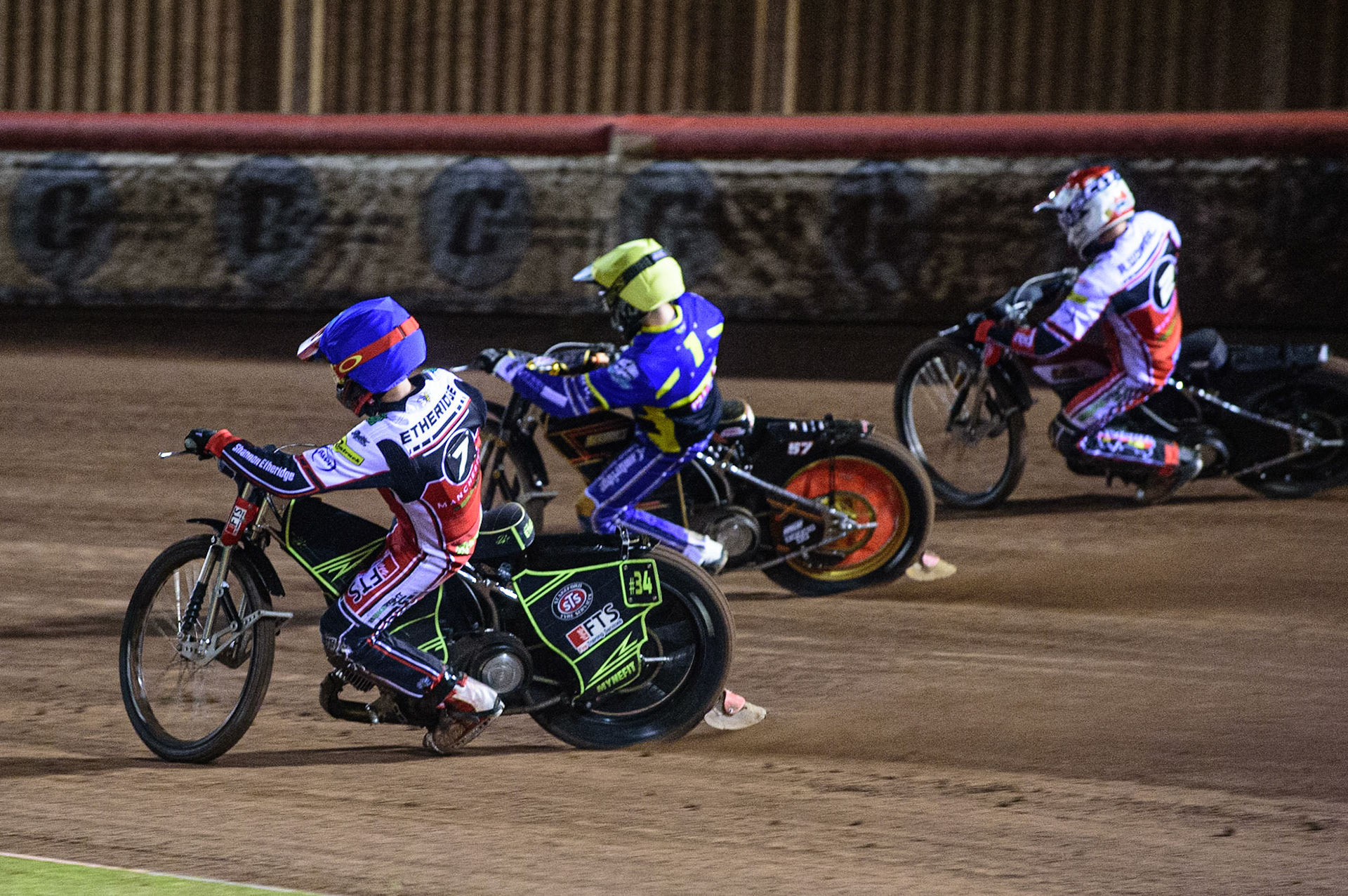 MANCHESTER, UK. OCT 7TH  Jye Etheridge   (Blue) inside Connor Mountain  (Yellow) and Richie Worrall  (Red) during the SGB Premiership Play off Semi-Final Second Leg between Belle Vue Aces and Sheffield Tigers at the National Speedway Stadium, Manchester on Thursday 7th October 2021. (Credit: Ian Charles | MI News)