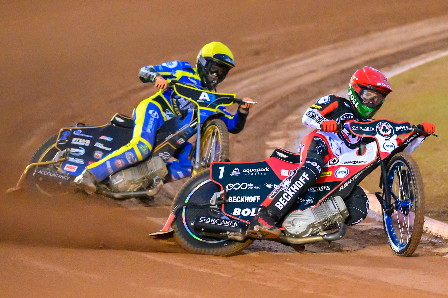 Brady Kurtz of Belle Vue Aces  in Red leading Anders Rowe of Sheffield Tigers    in Yellow during the Knockout Cup, Northern Section match between Belle Vue Aces and Sheffield Tigers at the National Speedway Stadium, Manchester on Monday 30th March 2026. (Photo: Ian Charles | MI News)