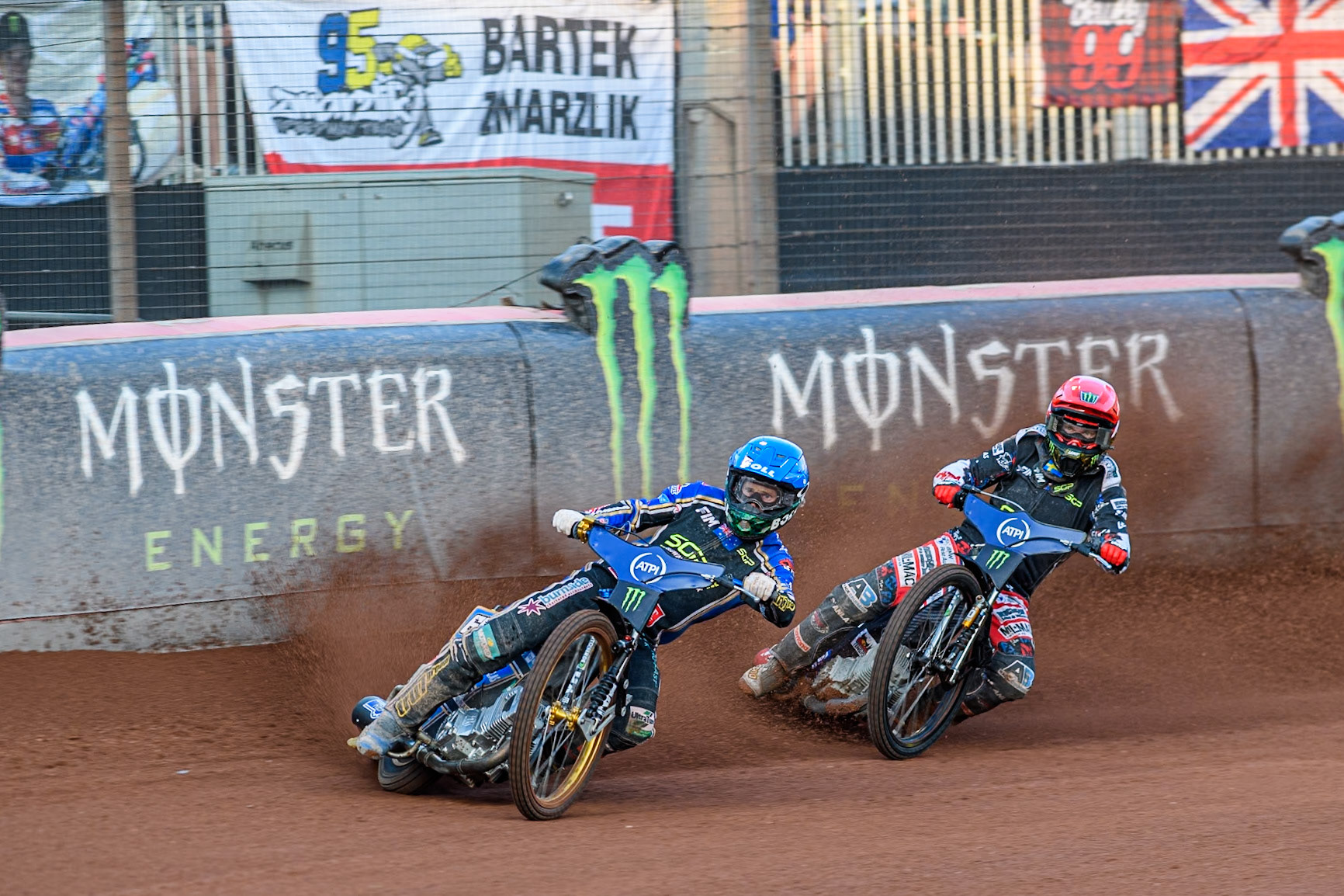 Jason Doyle (69) of Australia in Blue leading Fredrik Lindgren (66) of Sweden in Red during the ATPI FIM Speedway Grand Prix Round 5 at the National Speedway Stadium, Manchester, on Saturday 14th June 2025. (Photo: Ian Charles | MI News)