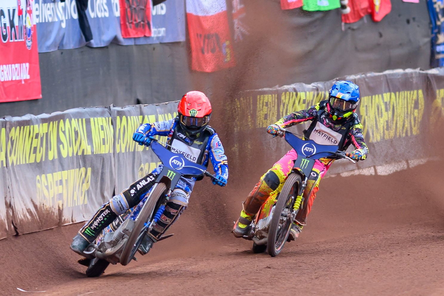 Jack Holder (25) of Australia in Red picks up some drive leading Michael Jepsen Jensen (52) of Denmark in Blue during the ATPI  FIM Speedway GP of Manchester at the National Speedway Stadium, Manchester on Saturday 6th June 2026. (Photo: Ian Charles | MI News)