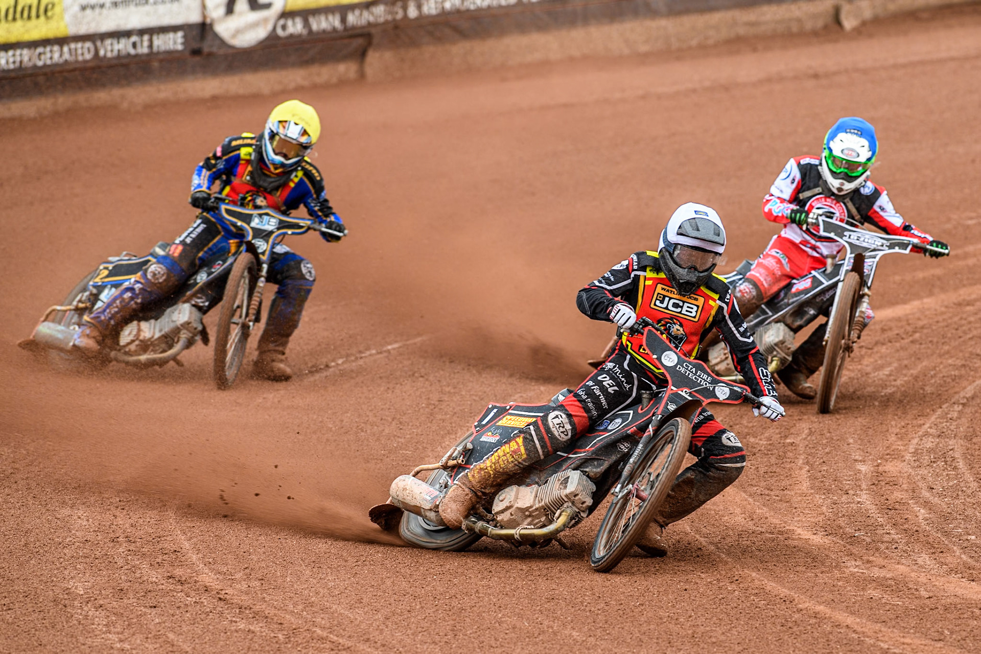 Leicester Lion Cubs' Guest Rider Ben Morley in White leading Belle Vue Colts' Jack Shimelt  in Blue and Leicester Lion Cubs' Eli Meadows  in Yellow during the WSRA National Development League match between Belle Vue Colts and Leicester Lion Cubs at the National Speedway Stadium, Manchester on Friday 18th April 2025. (Photo: Ian Charles | MI News)