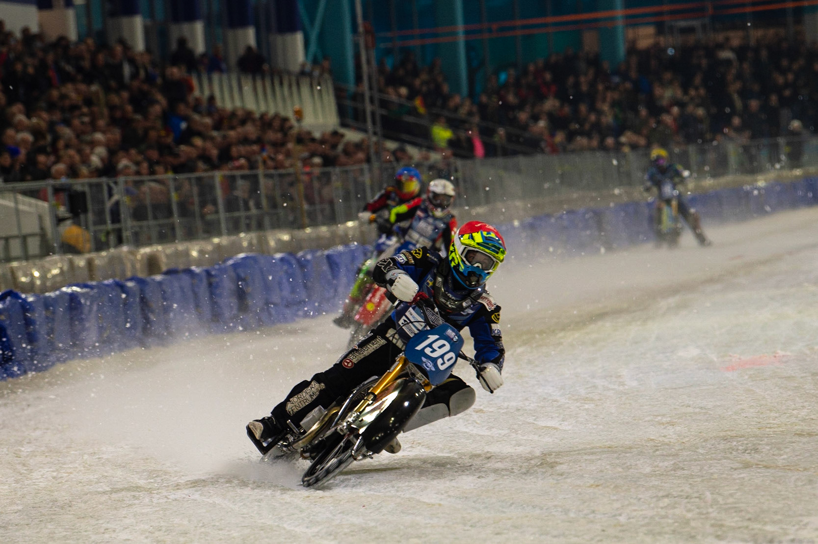 HEERENVEEN, NL. Martin Hååruhiltunen (199)  leads the Grand Final during the FIM Ice Speedway Gladiators World Championship Final 3 at Ice Rink Thialf, Heerenveen on Saturday  2 April 2022. (Credit: Ian Charles | MI News)