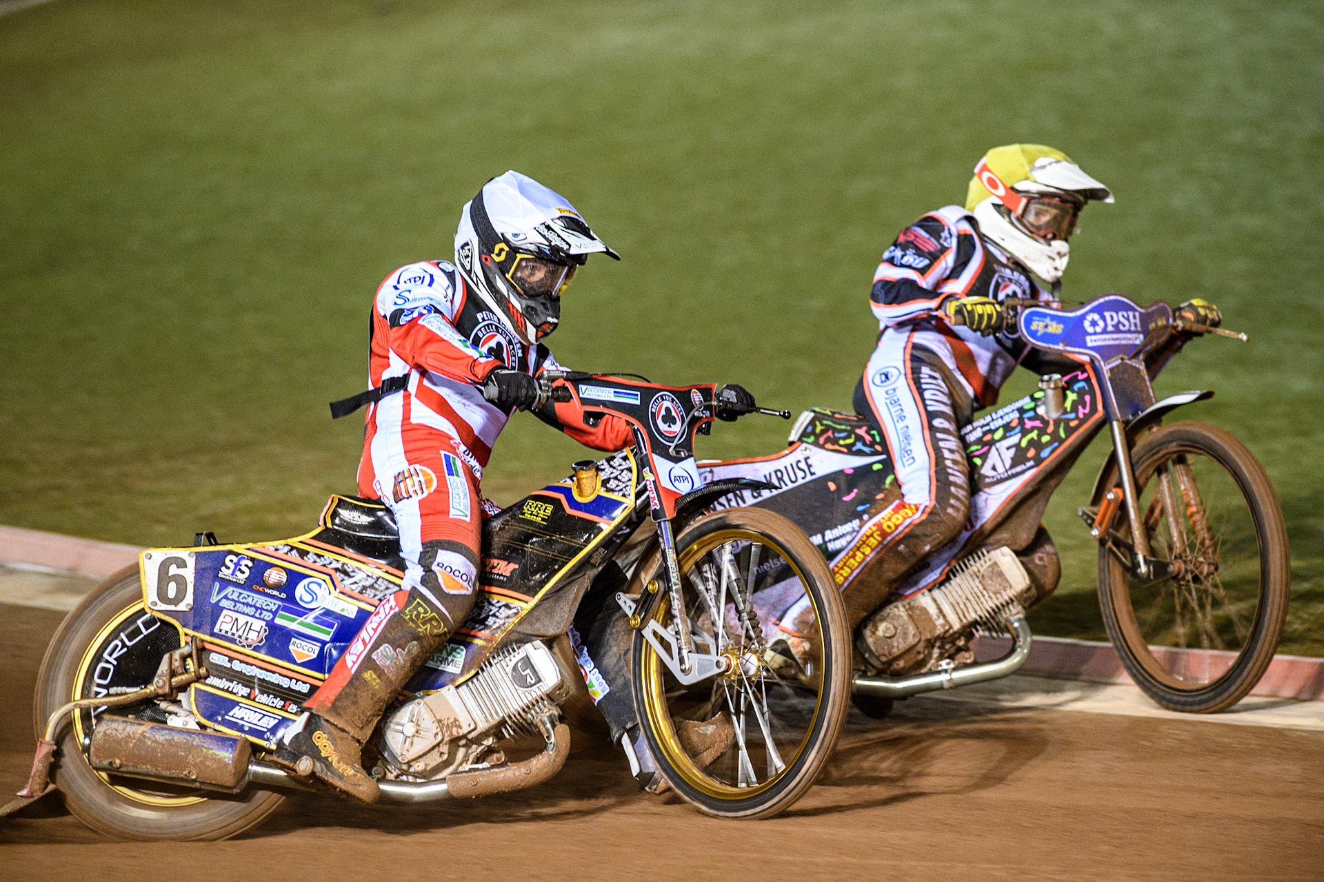 England's Connor Mountain (White) outside Denmark's Niels-Kristian Iversen (Yellow) during the Peter Craven Memorial Trophy meeting at the National Speedway Stadium, Manchester on Monday 18th March 2024. (Photo: Ian Charles | MI News)