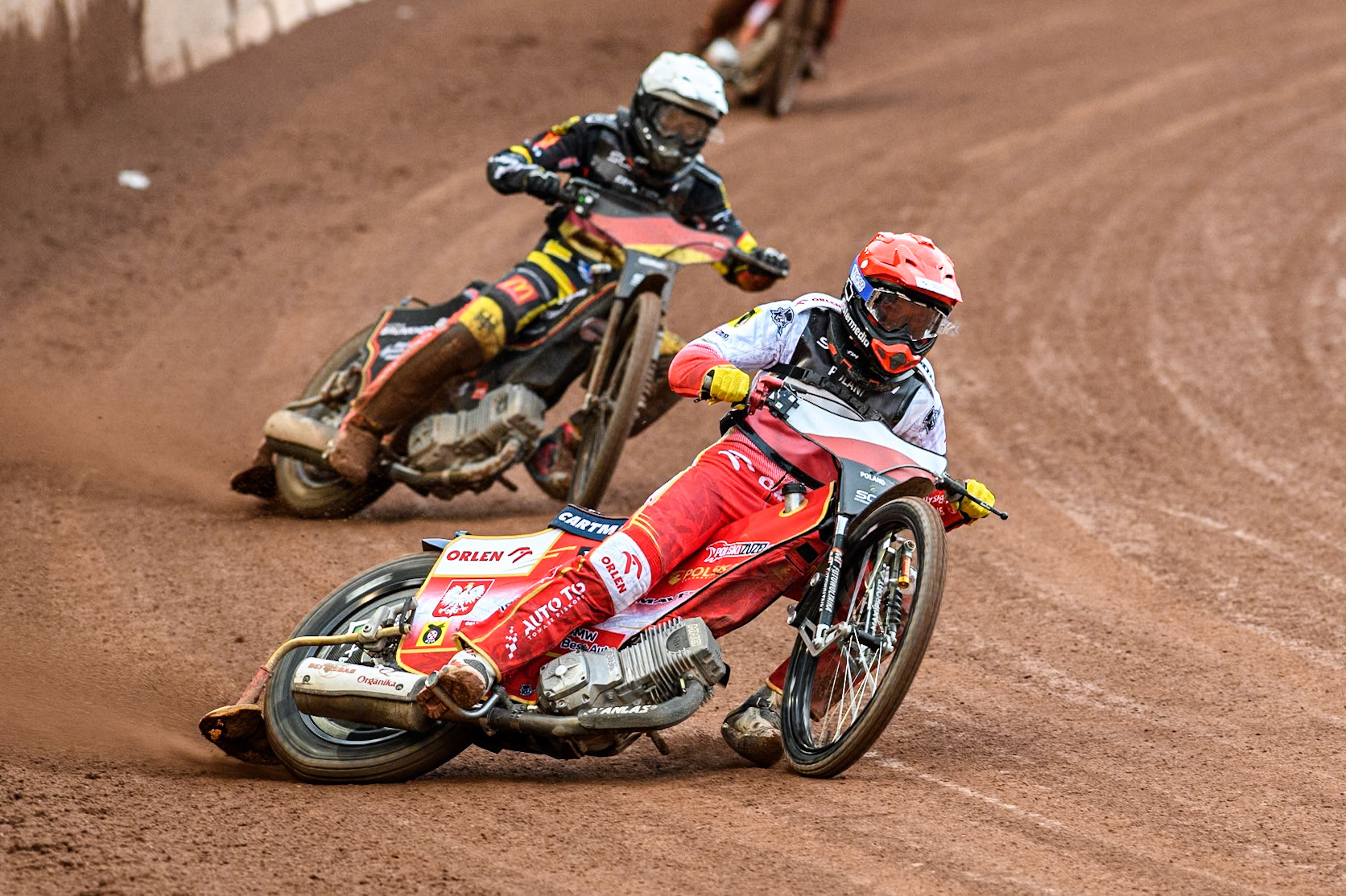 Dominik Kubera of Poland in Red leading Kai Huckenbeck of Germany in White during the Monster Energy FIM Speedway of Nations Semi-Final 1 at the National Speedway Stadium, Manchester on Tuesday 9th July 2024. (Photo: Ian Charles | MI News)
