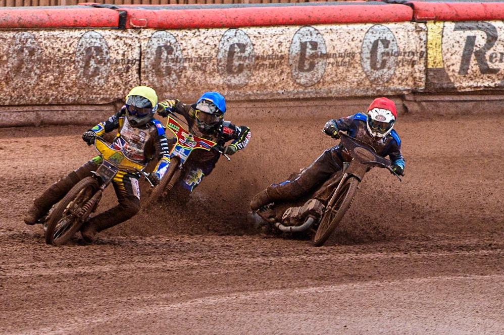 Ben Barker (Yellow) leads as Richard Lawson (Red) and Simon Lambert (Blue) struggle on the heavy track during the Sports Insure British Speedway Final at the National Speedway Stadium, Manchester on Monday 14th August 2023. (Photo: Ian Charles | MI News)