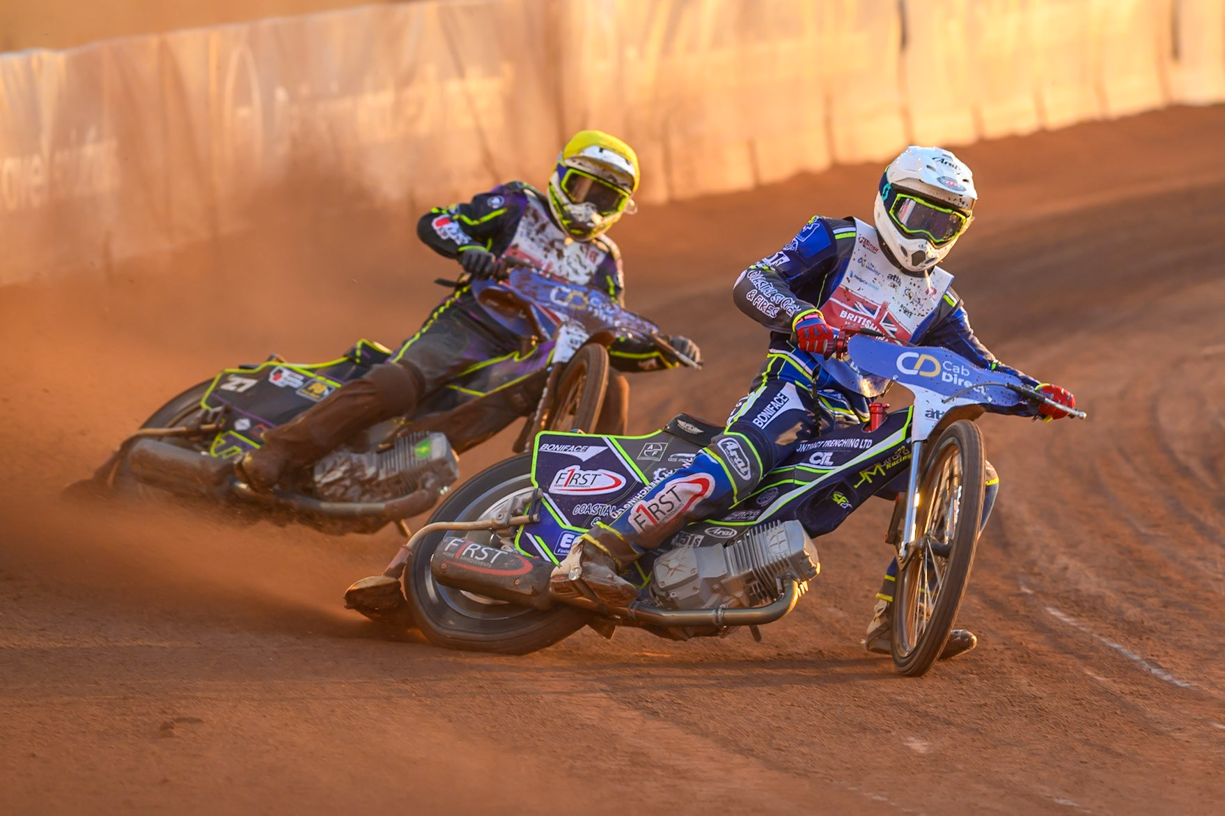 Jake Mulford (12) in White leading Tom Brennan (16) in Yellow during the Cab Direct British Speedway Championship Final at the National Speedway Stadium, Manchester on Saturday 15th August 2026. (Photo: Ian Charles | MI News)