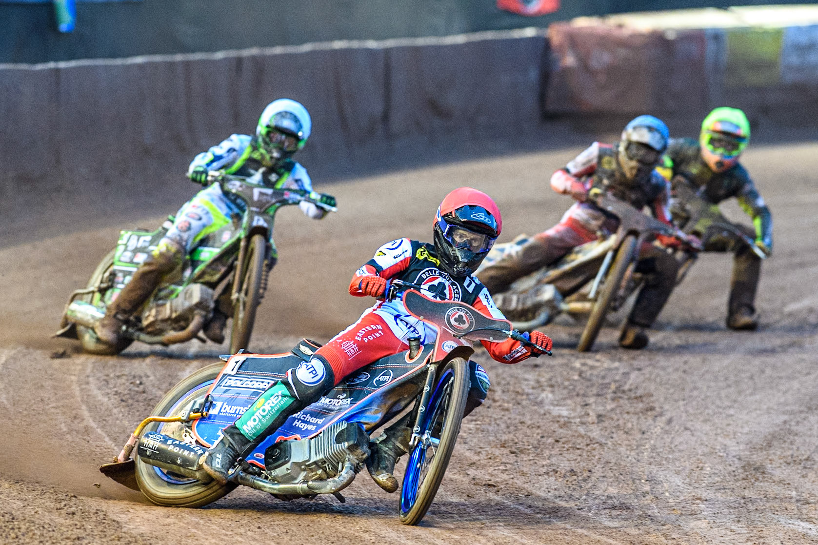 Belle Vue Aces' Brady Kurtz in Red leading Ipswich Witches' Guest Charles Wright in White, Belle Vue Aces' Norick Blödorn in Blue and Ipswich Witches' Keynan Rew in Yellow during the Rowe Motor Oil Premiership match between Belle Vue Aces and Ipswich Witches at the National Speedway Stadium, Manchester on Monday 22nd April 2024. (Photo: Ian Charles | MI News)