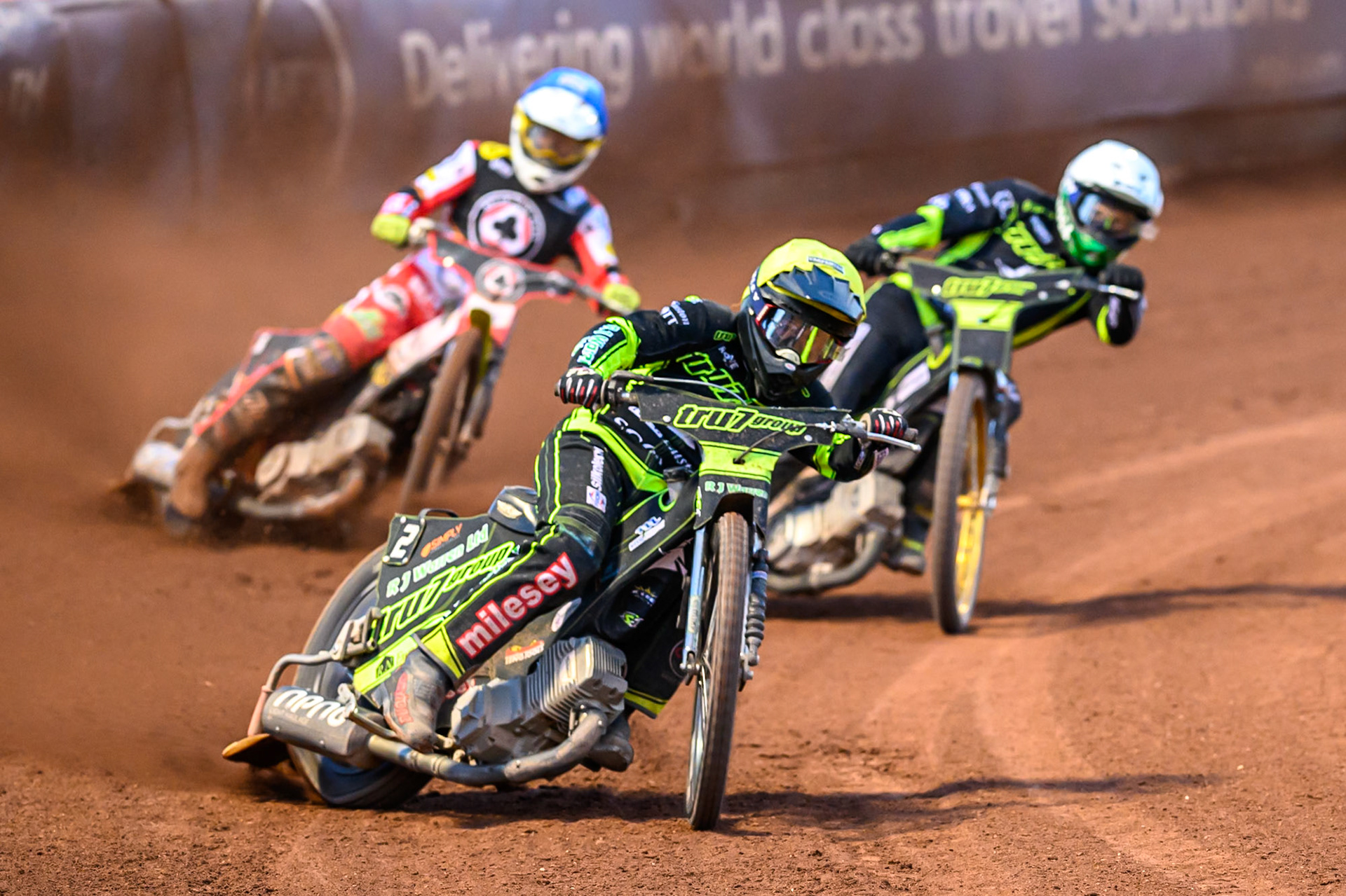 Danny King of Ipswich Witches  in Yellow leading Jason Doyle of Ipswich Witches  in White and Jake Mulford of Belle Vue Aces  in Blue during the Rowe Motor Oil Premiership match between Belle Vue Aces and Ipswich Witches at the National Speedway Stadium, Manchester on Monday 4th August 2025. (Photo: Ian Charles | MI News)