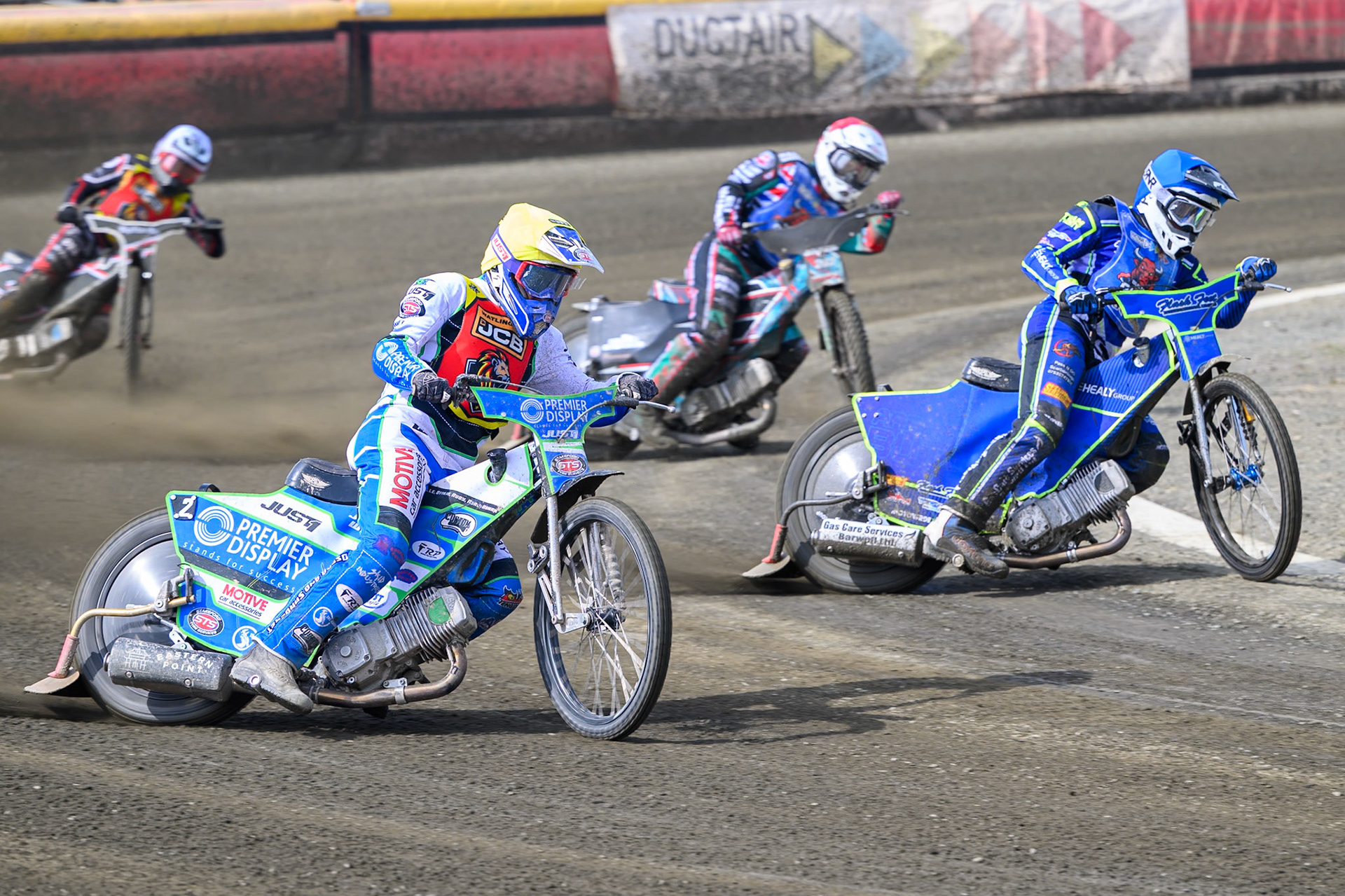 Tom Spencer of Leicester Lion Cubs  in Yellow rides outside Arran Butcher of Buxton Bulls  with Alfie Bowtell of Buxton Bulls  behind during the Challenge match between Buxton Bulls and Leicester Lion Cubs at Hi-Edge Speedway, Buxton on Sunday 26th April 2026. (Photo: Ian Charles | MI News)