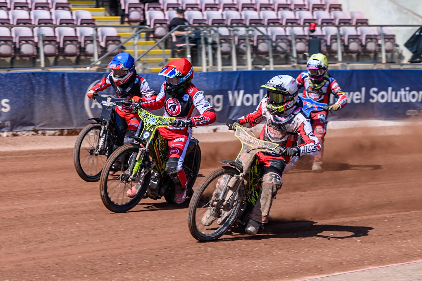Ace Pijper of Middlesborough Tigers  in White leading William Cairns of Belle Vue Colts  in Red, Freddy Hodder of Belle Vue Colts , in Blue and Stene Pijper of Middlesborough Tigers  in Yellow during the WSRA National Development League match between Belle Vue Colts and Middlesbrough Tigers at the National Speedway Stadium, Manchester on Sunday 10th August 2025. (Photo: Mark Fletcher | MI News)