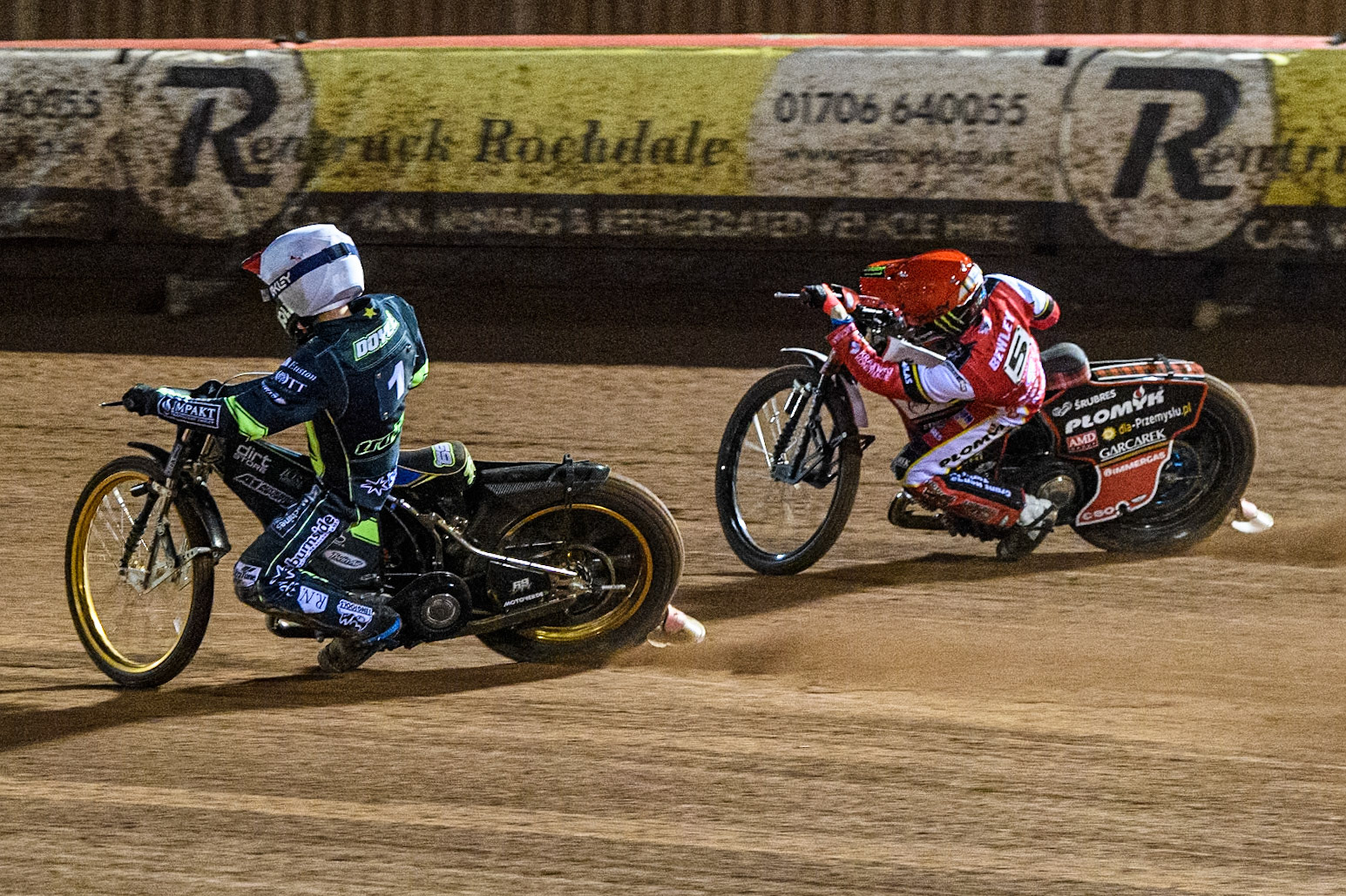 Jason Doyle of Ipswich Witches in White rides inside Dan Bewley of Belle Vue Aces in Red during the Premiership Cup Quarter Final 1st Leg match between Belle Vue Aces and Ipswich Witches at the National Speedway Stadium, Manchester on Monday 24th March 2025. (Photo: Ian Charles | MI News)