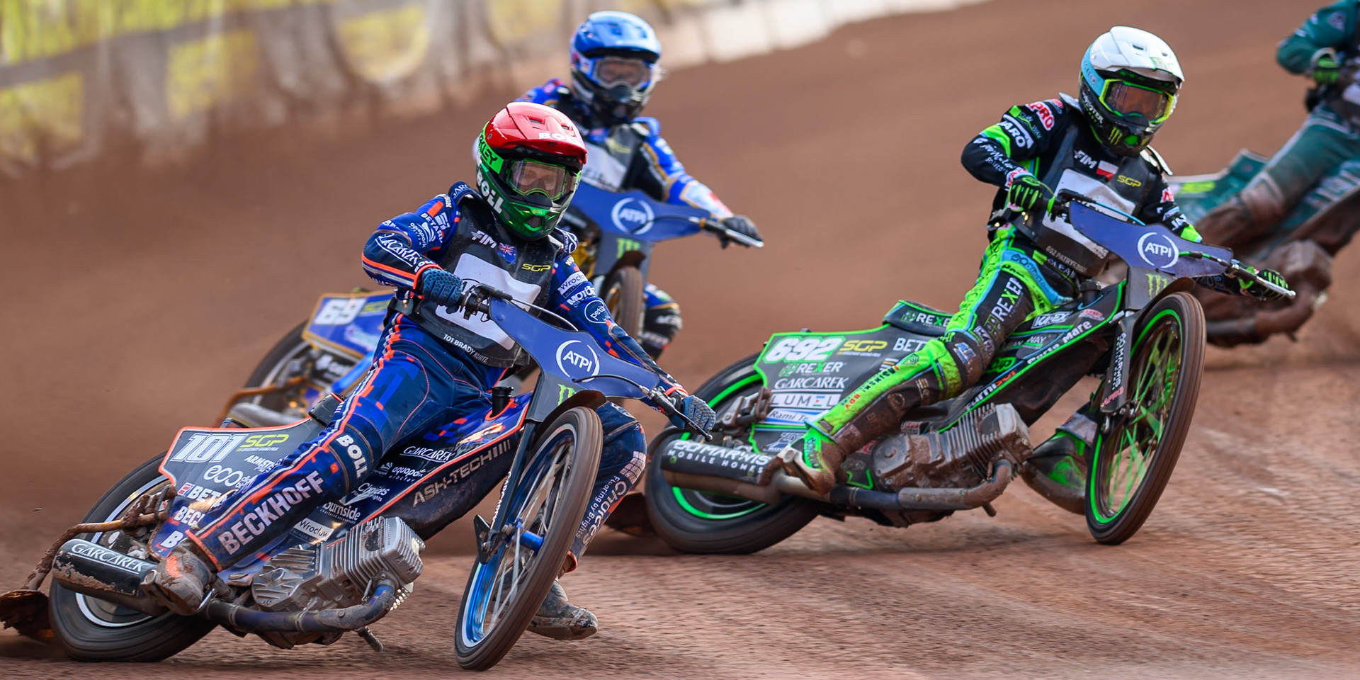 Brady Kurtz (101) of Australia in Red leading Patryk Dudek (692) of Poland in White and Jason Doyle (69) of Australia in Blue during the ATPI  FIM Speedway GP of Manchester at the National Speedway Stadium, Manchester on Friday 5th June 2026. (Photo: Ian Charles | MI News)
