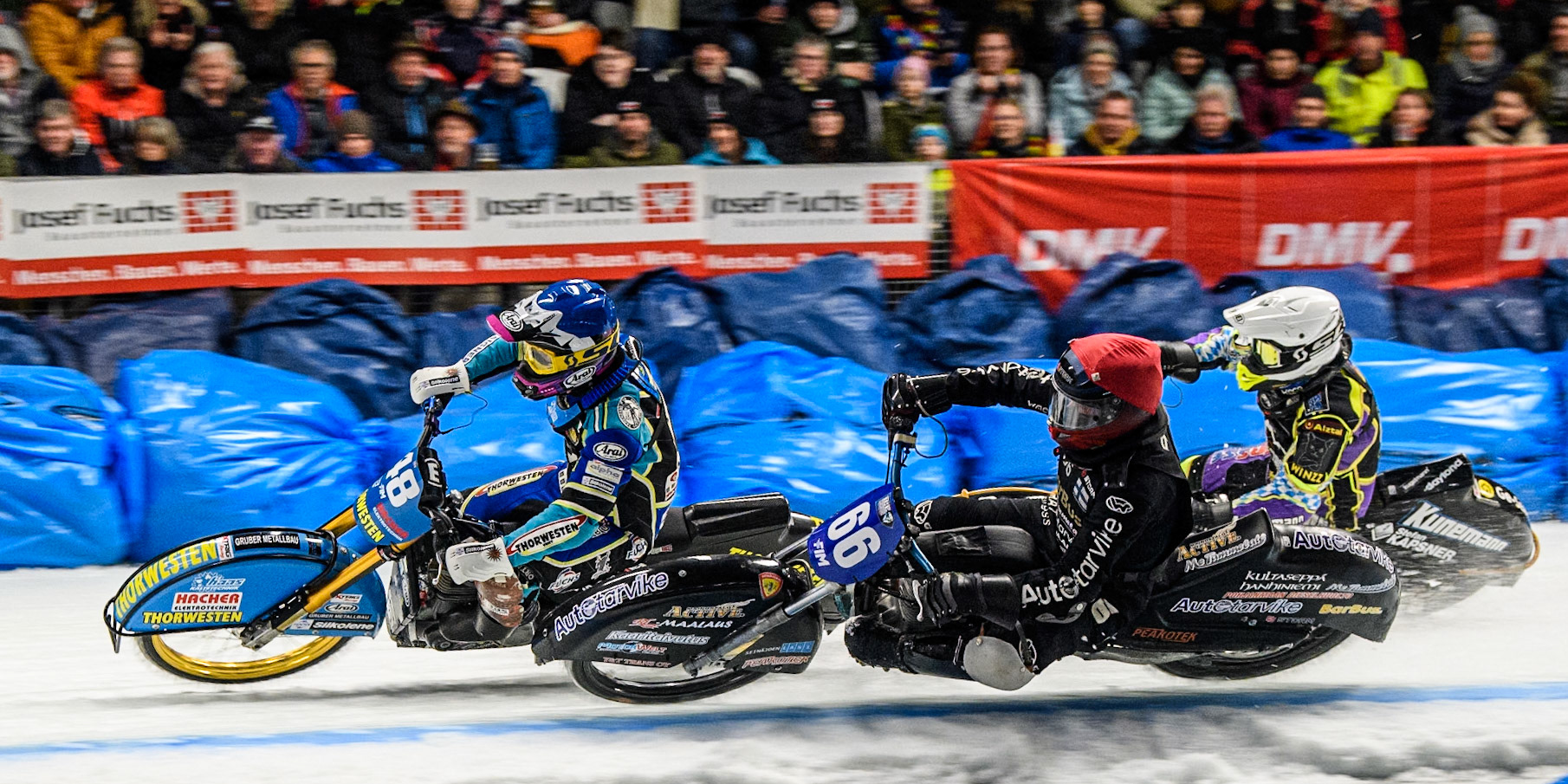 Aki Ala-Riihimäki (66) of Finland in Red rides inside Luca Bauer (48) of Germany in Blue and Max Niedermaier  (88) of Germany in White during the Ice Speedway Gladiators World Championship Final 1 at Max-Aicher-Arena, Inzell on Saturday 15th March 2025. (Photo: Ian Charles | MI News)
