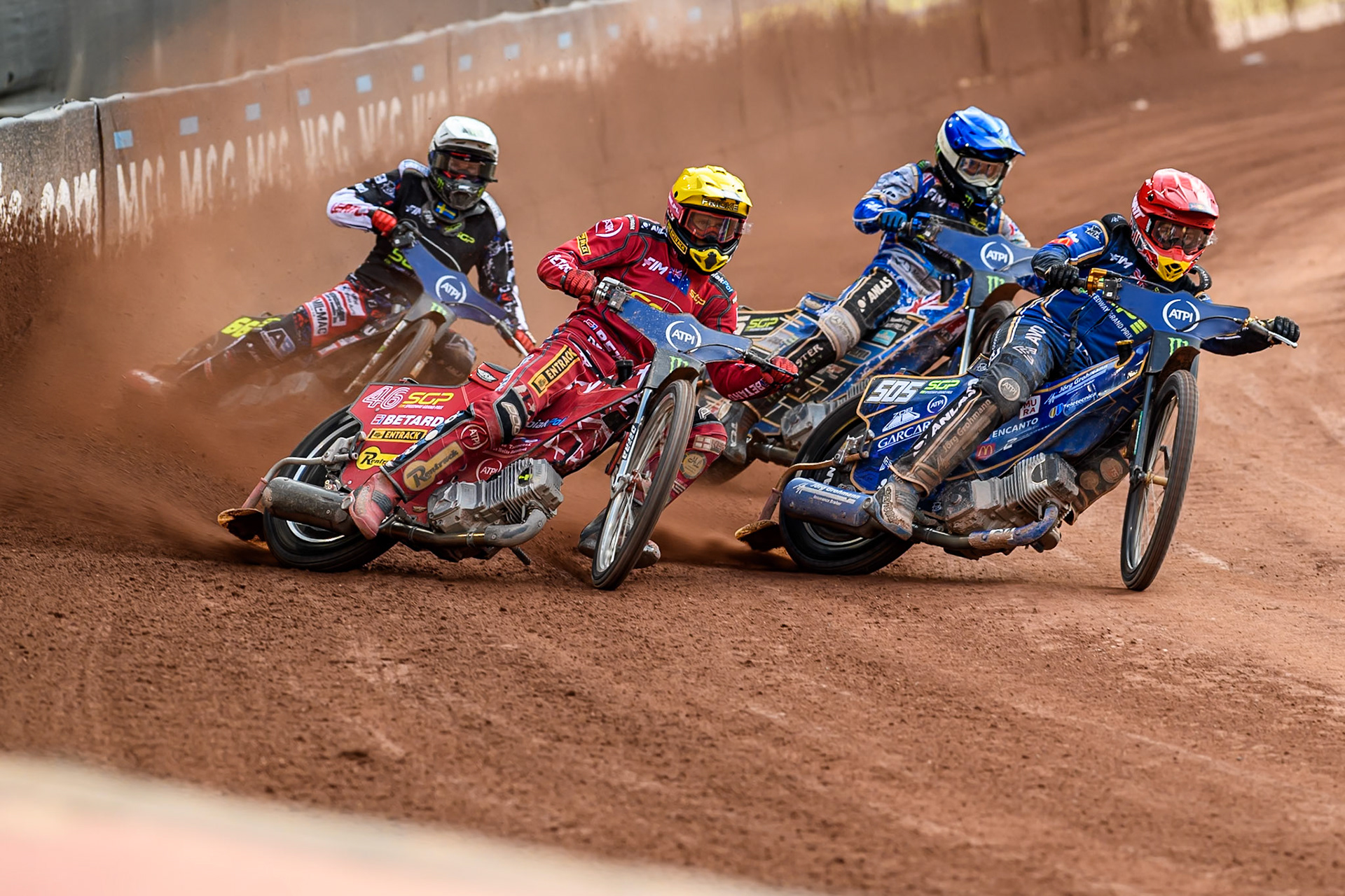 Robert Lambert (505) of Great Britain in Red rides inside Max Fricke (46) of Australia in Yellow with Jack Holder (25) of Australia in Blue  and Fredrik Lindgren (66) of Sweden in White behind during the ATPI FIM Speedway Grand Prix Round 4 at the National Speedway Stadium, Manchester, on Friday 13th June 2025. (Photo: Ian Charles | MI News)