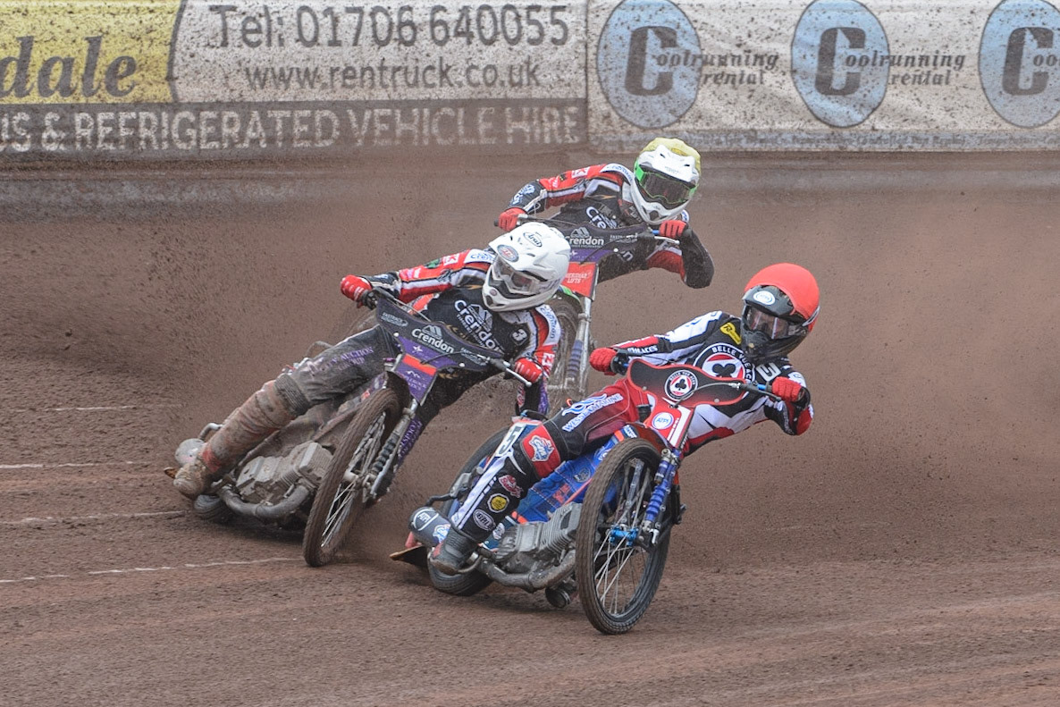 MANCHESTER, UK. MAY 2ND Brady Kurtz  (Red) leads Ulrich Ostergaard  (White) and Hans Andersen   (Yellow)  during the SGB Premiership match between Belle Vue Aces and Peterborough at the National Speedway Stadium, Manchester on Monday 2nd May 2022. (Credit: Ian Charles | MI News)