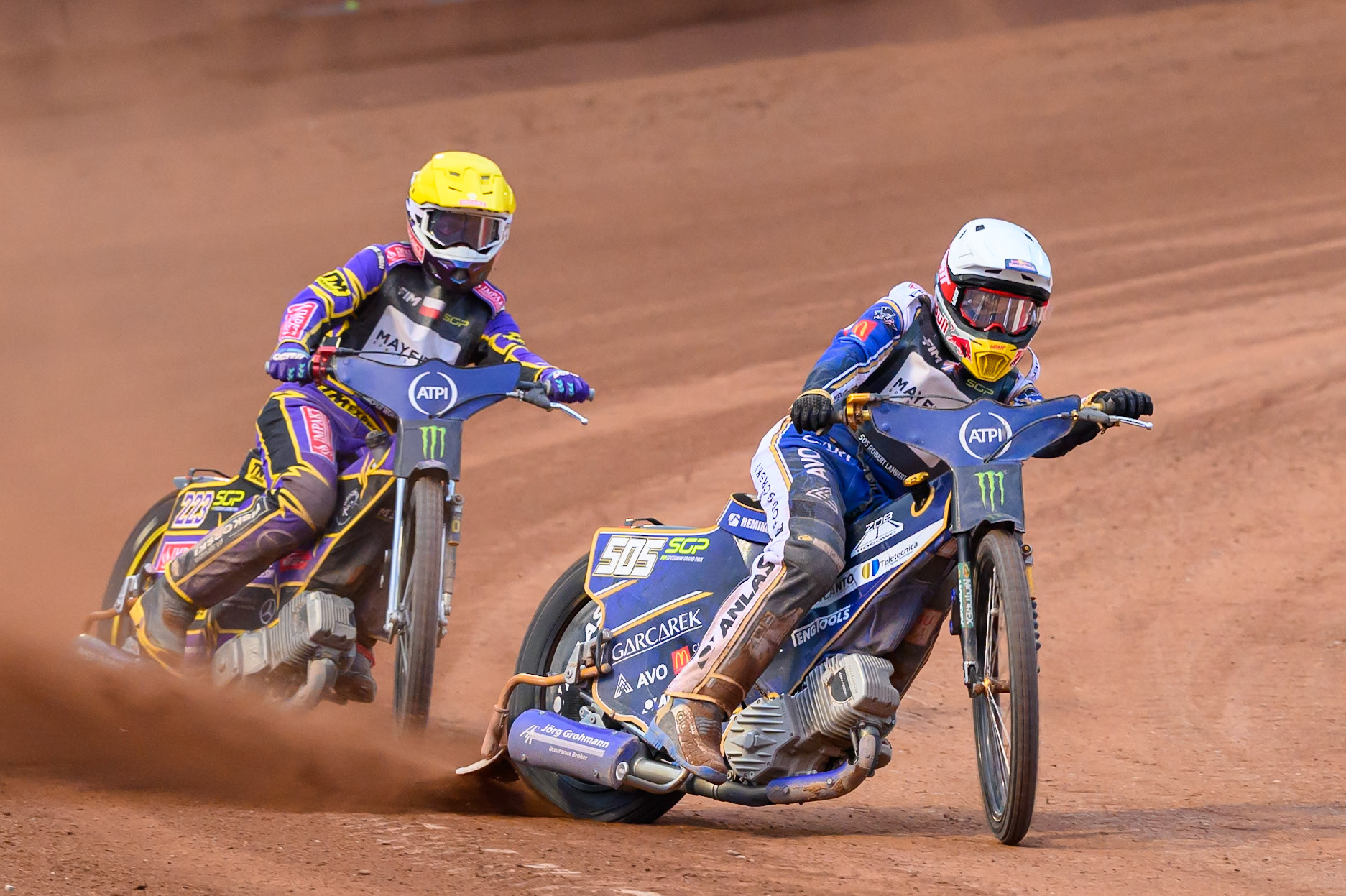 Robert Lambert (505) of Great Britain in White leading Kacper Woryna (223) of Poland in Yellow during the ATPI  FIM Speedway GP of Manchester at the National Speedway Stadium, Manchester on Saturday 6th June 2026. (Photo: Ian Charles | MI News)